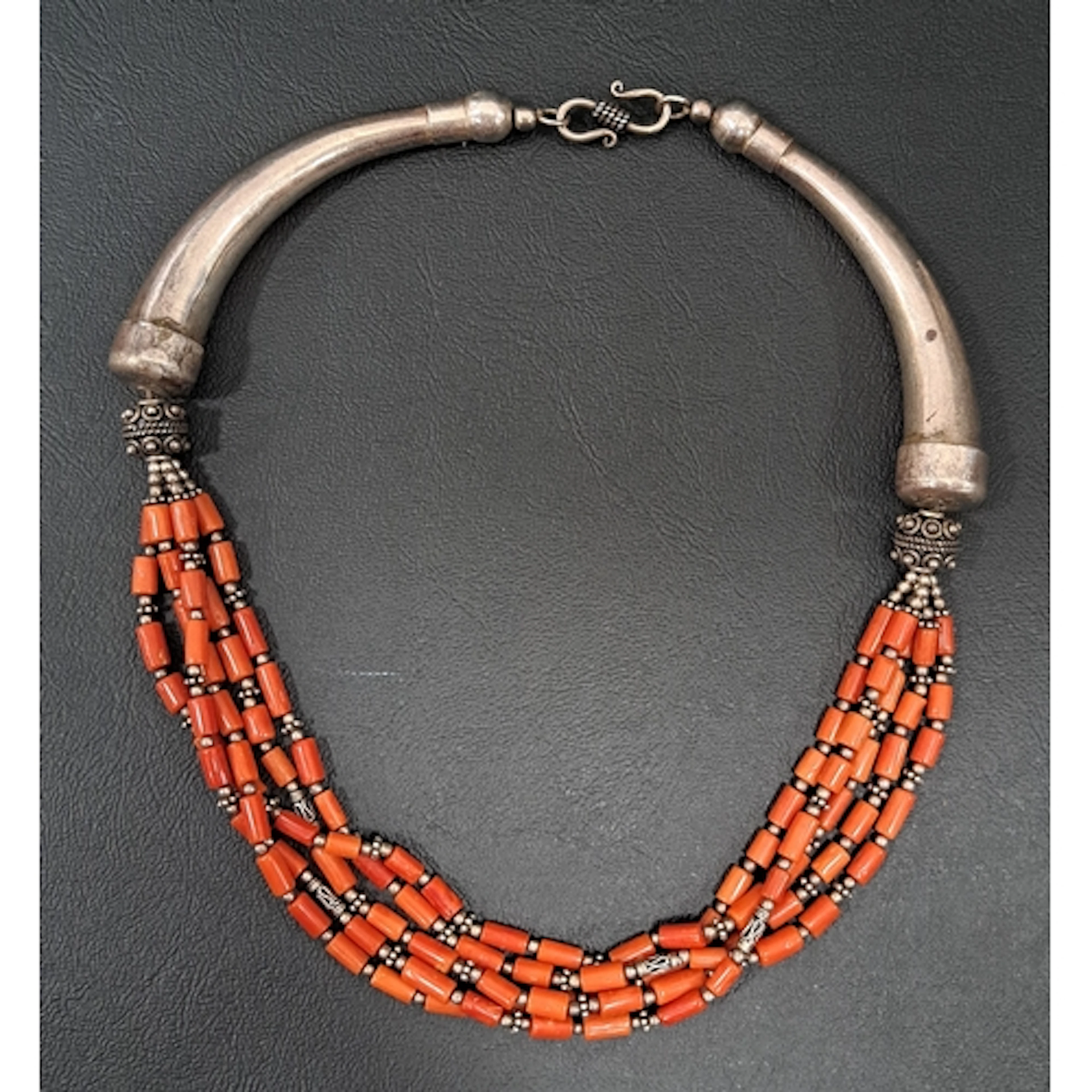 SILVER AND CORAL NECKLACE with five coral strands suspended ...