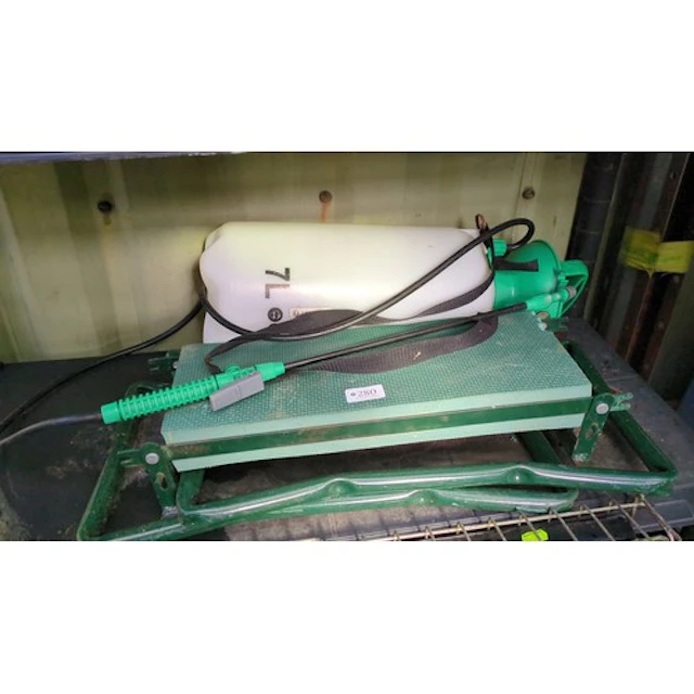 Garden pressure sprayer with a folding garden kneeler.