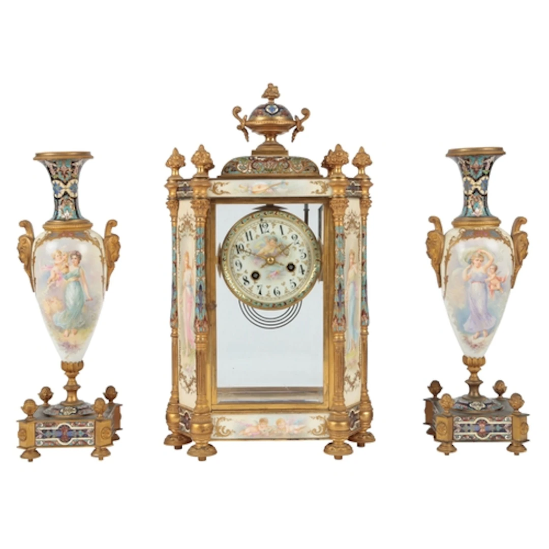 A French gilt brass and Champlevé enamel four glass mantel c...