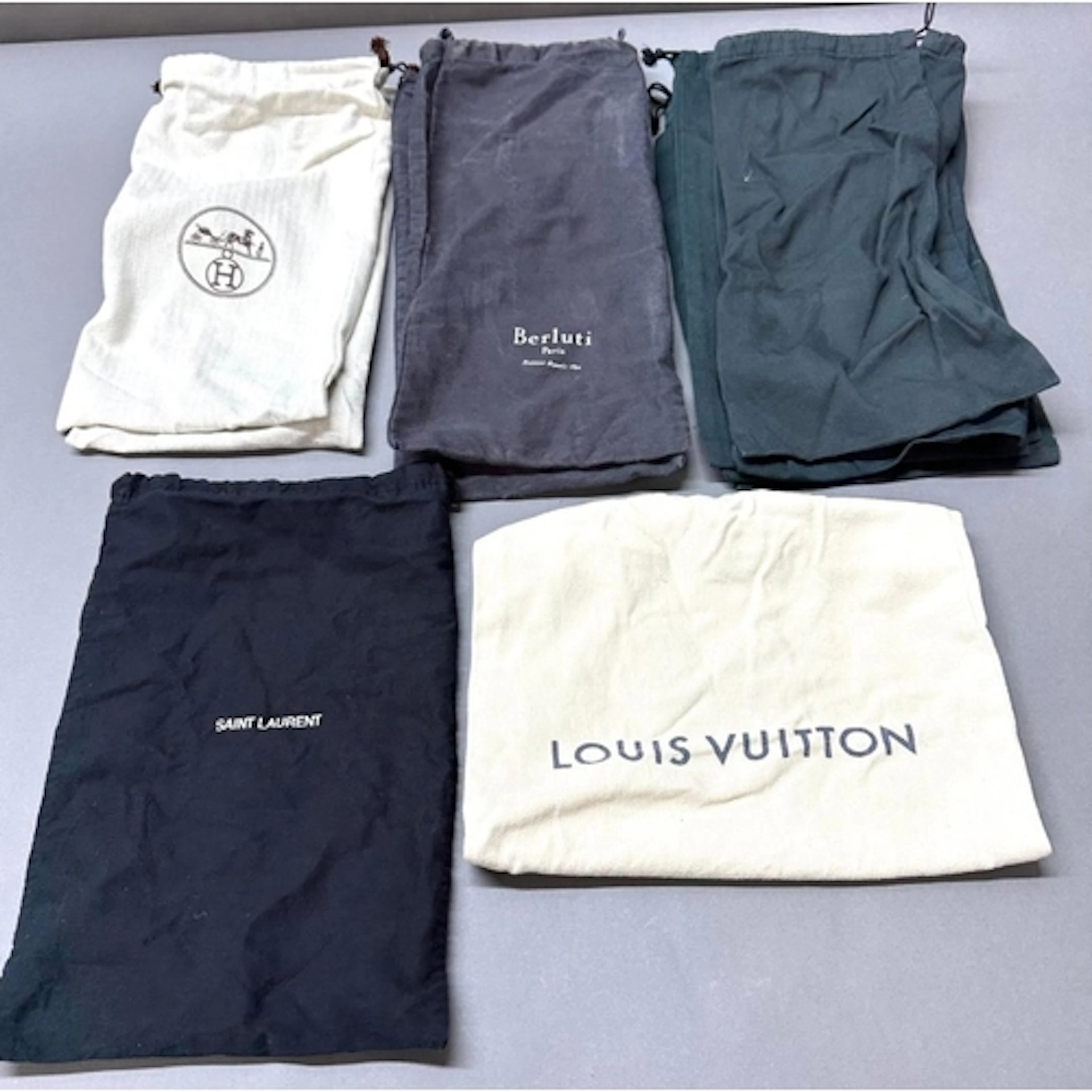 A selection of designer fashion dust bags to include: Louis ...