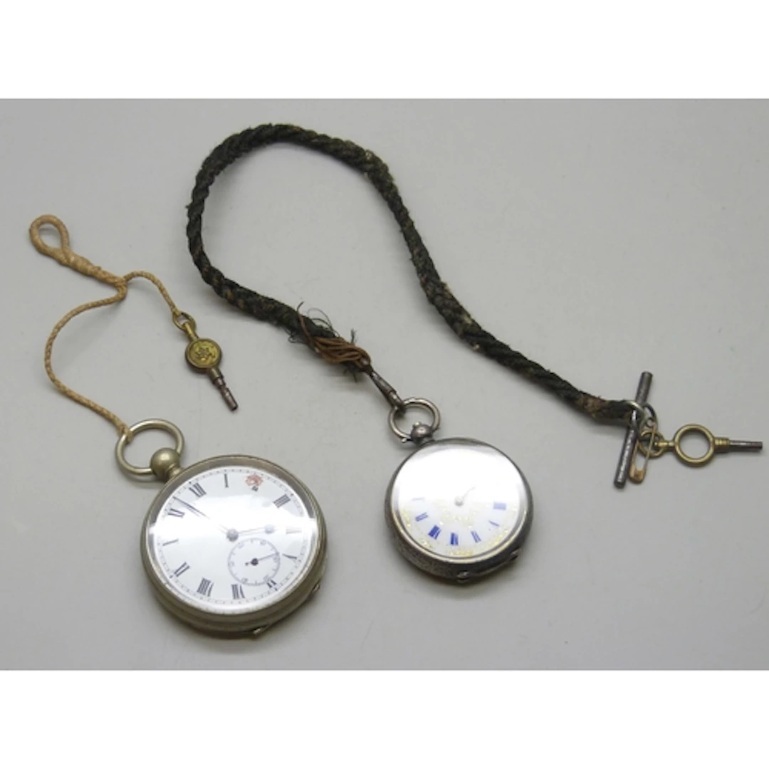 A .935 silver fob watch with enamel dial, 51g, and a plated ...