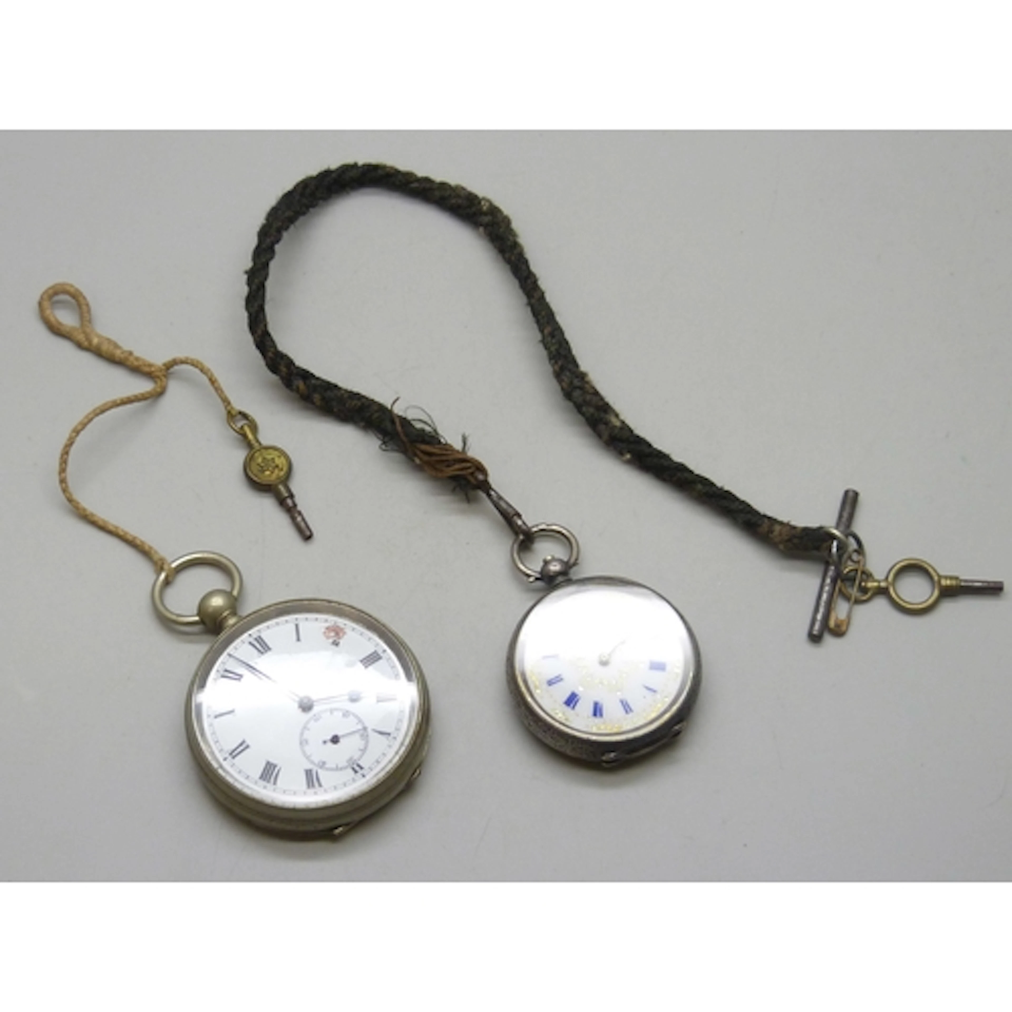 A .935 silver fob watch with enamel dial, 51g, and a plated ...