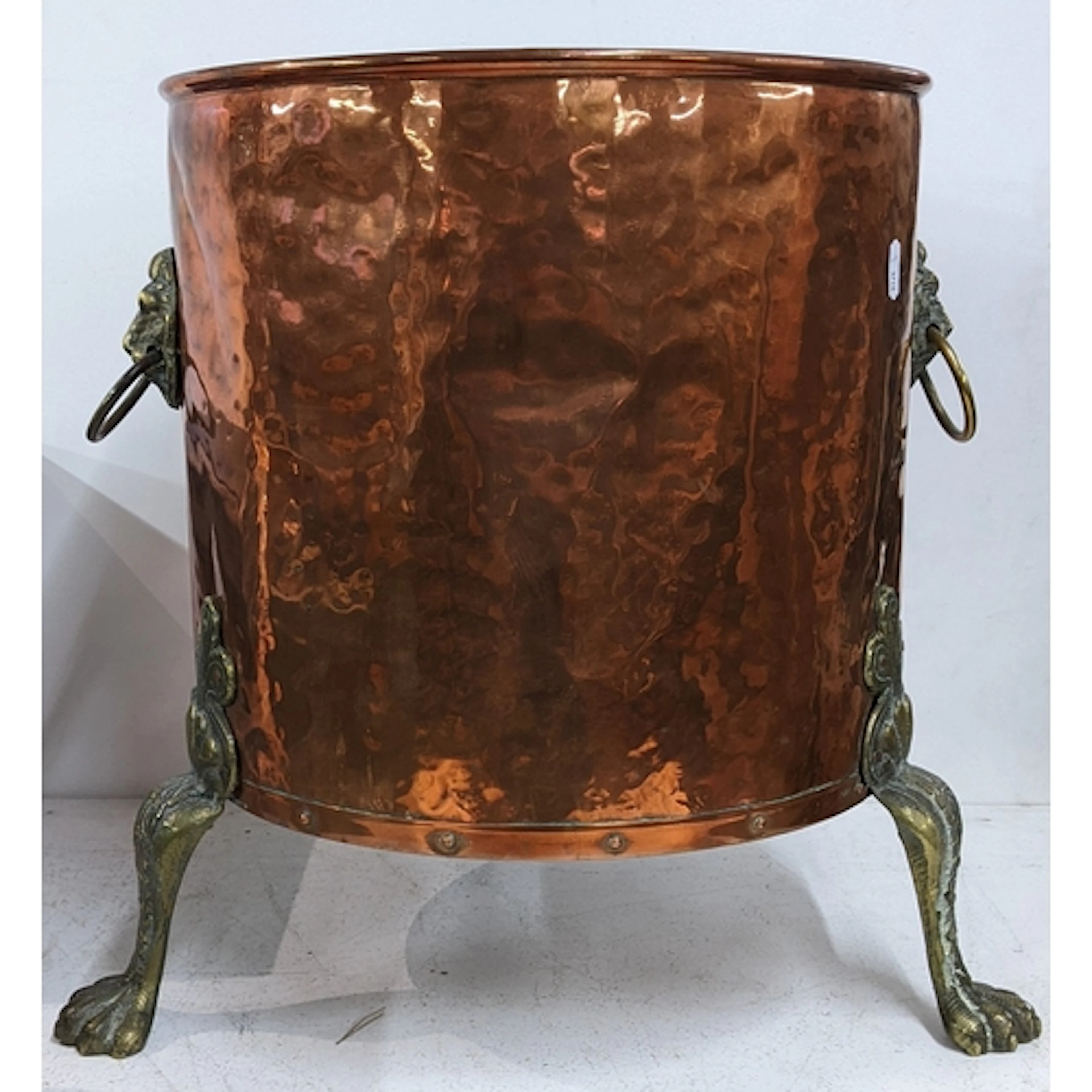 A Victorian copper and brass log/coal bucket having lion rin...