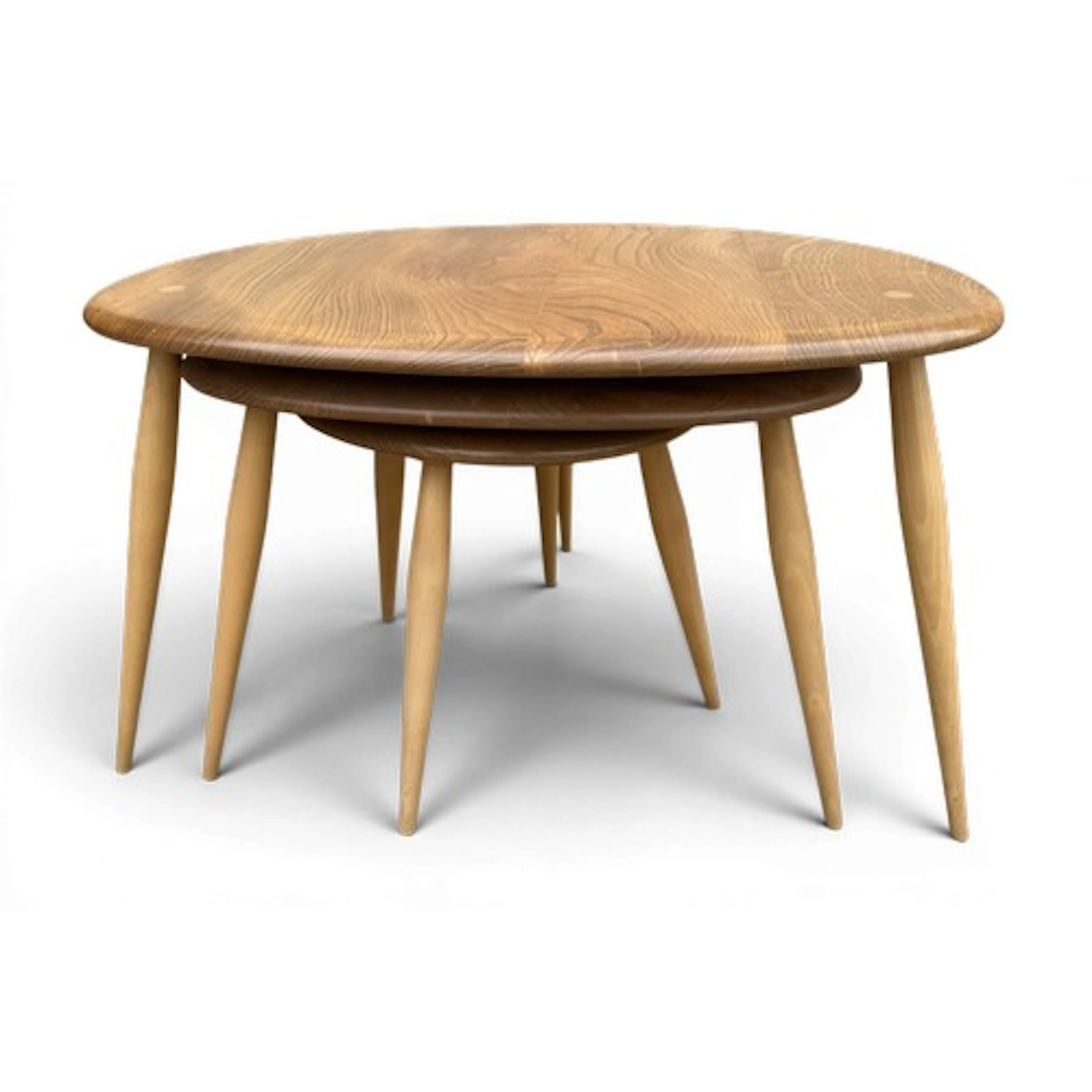 A nest of 3 Ercol pebble tables. Largest 65 w x 45 d x 40cm ...