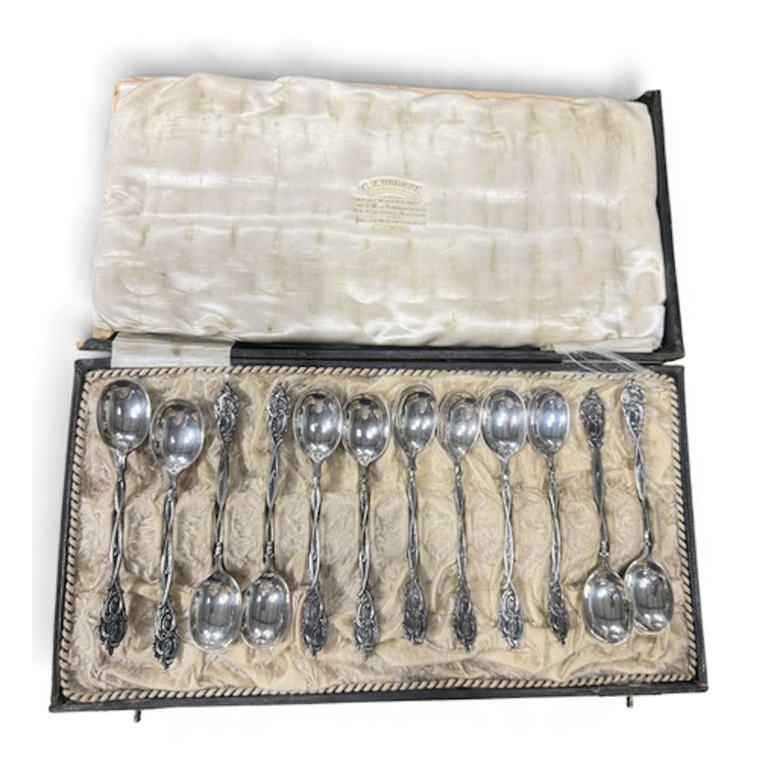 A SET OF 12 DUTCH SILVER TEASPOONS, CASED BY C J BEGEER, UTR...