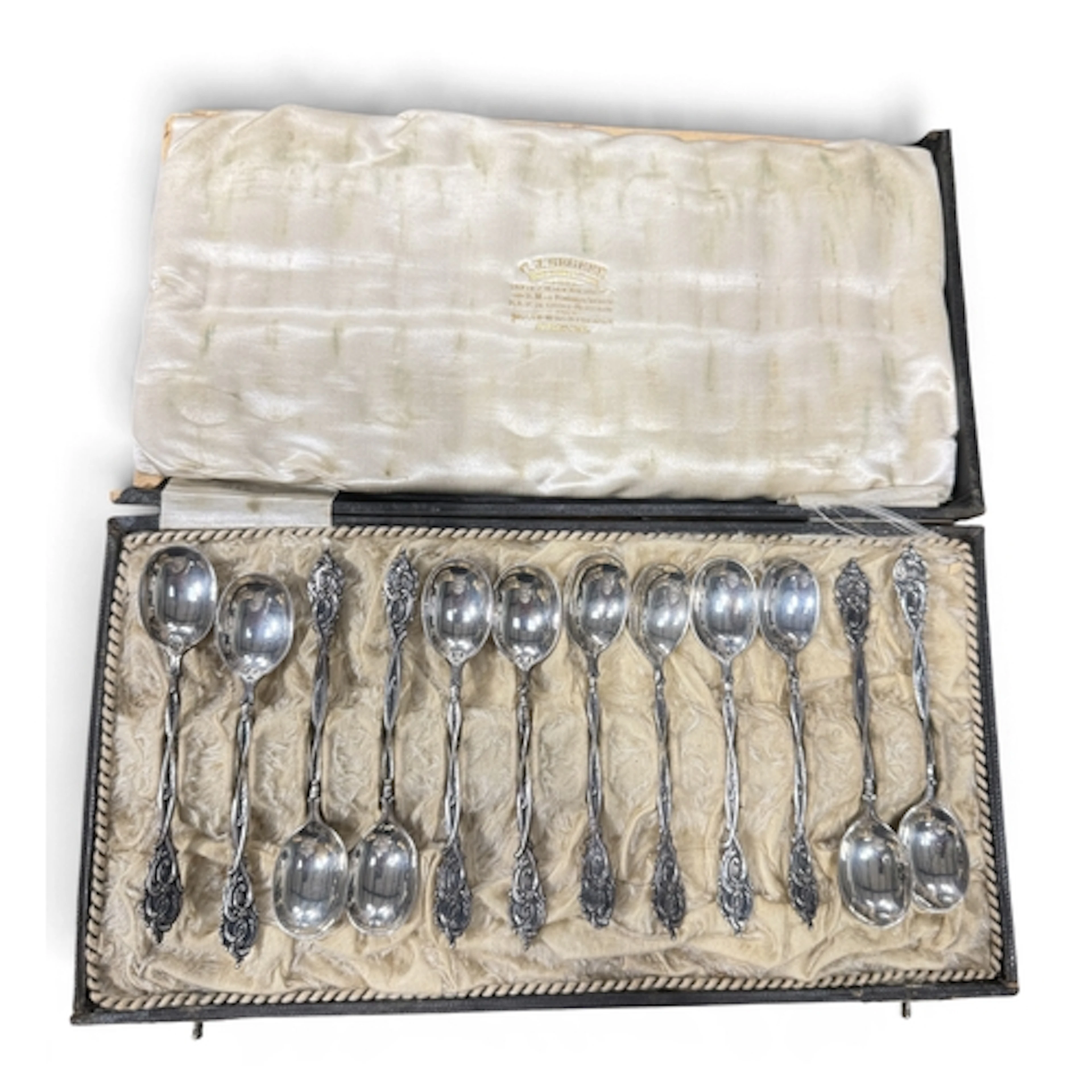 A SET OF 12 DUTCH SILVER TEASPOONS, CASED BY C J BEGEER, UTR...