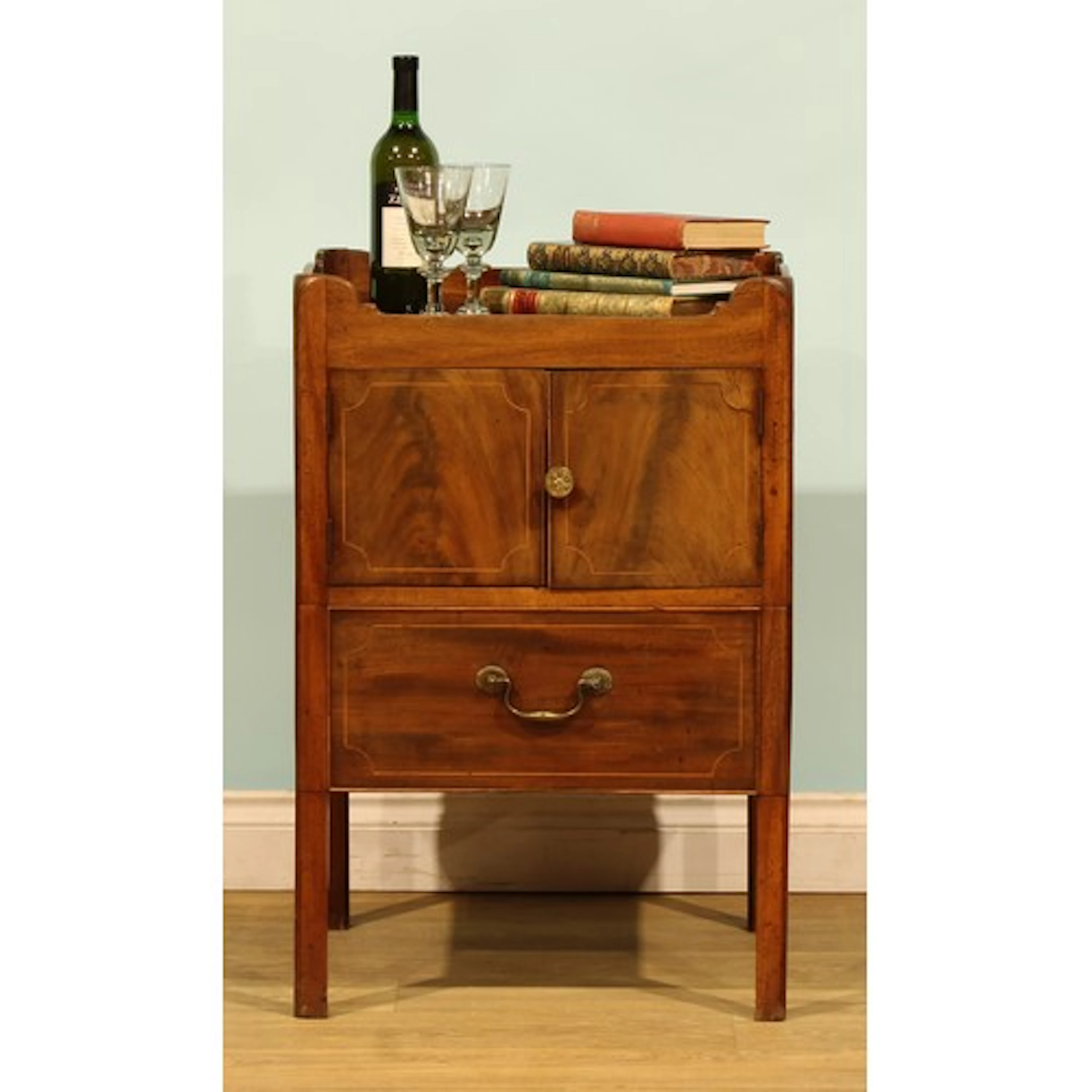 A George III mahogany and marquetry inlaid tray-top bedside ...