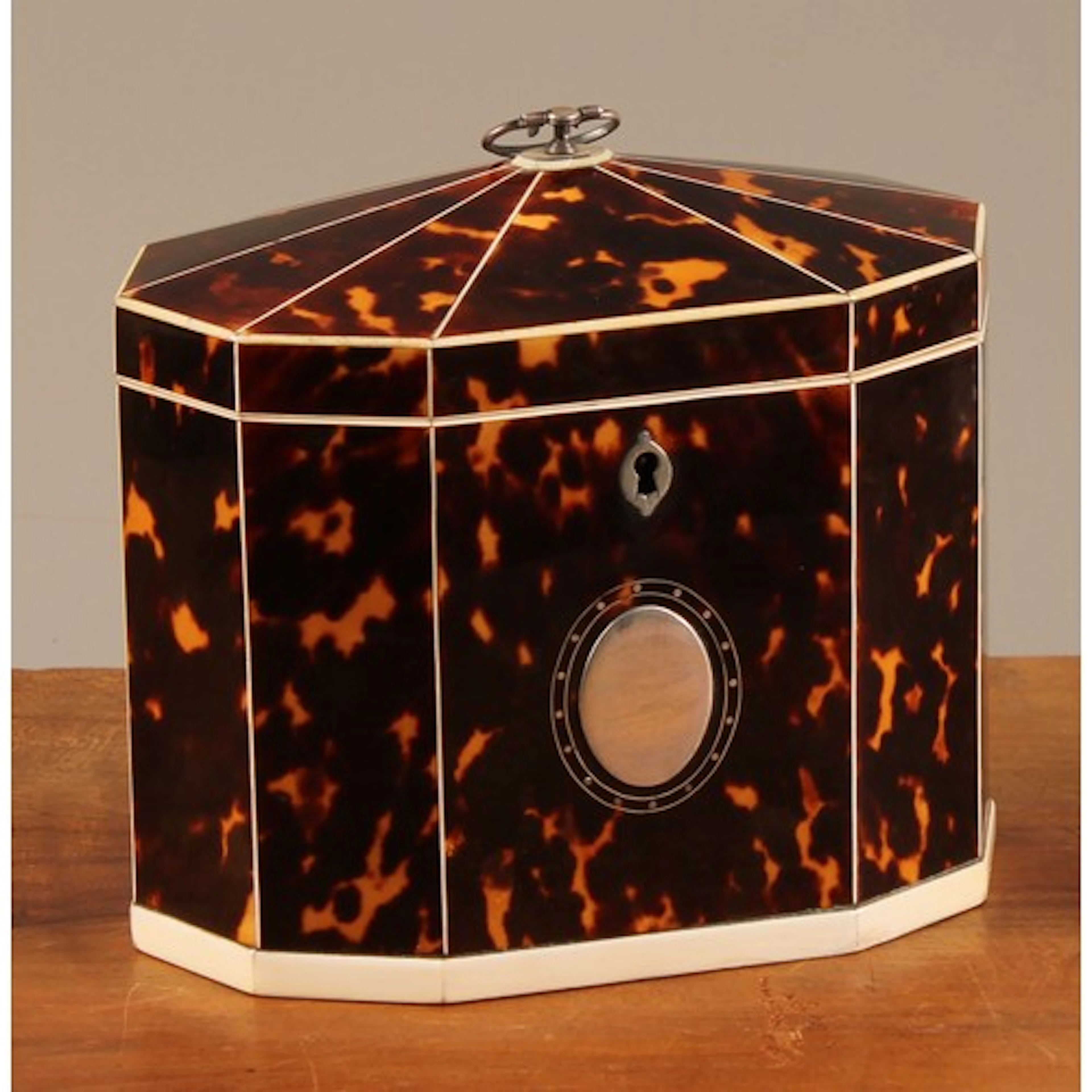 A George III tortoiseshell and ivory decagonal tea caddy, hi...