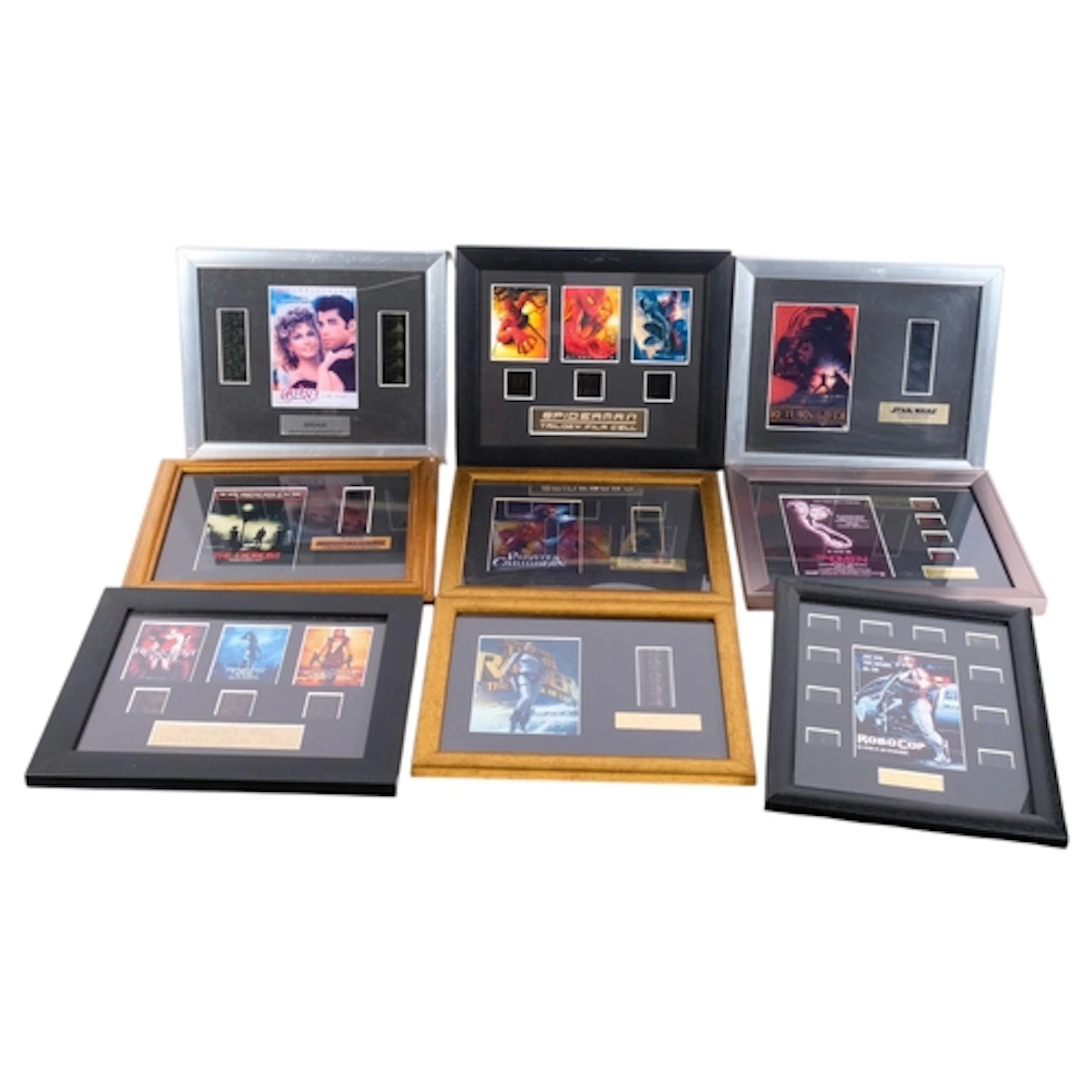 A collection of framed movie advertising stills, including S...