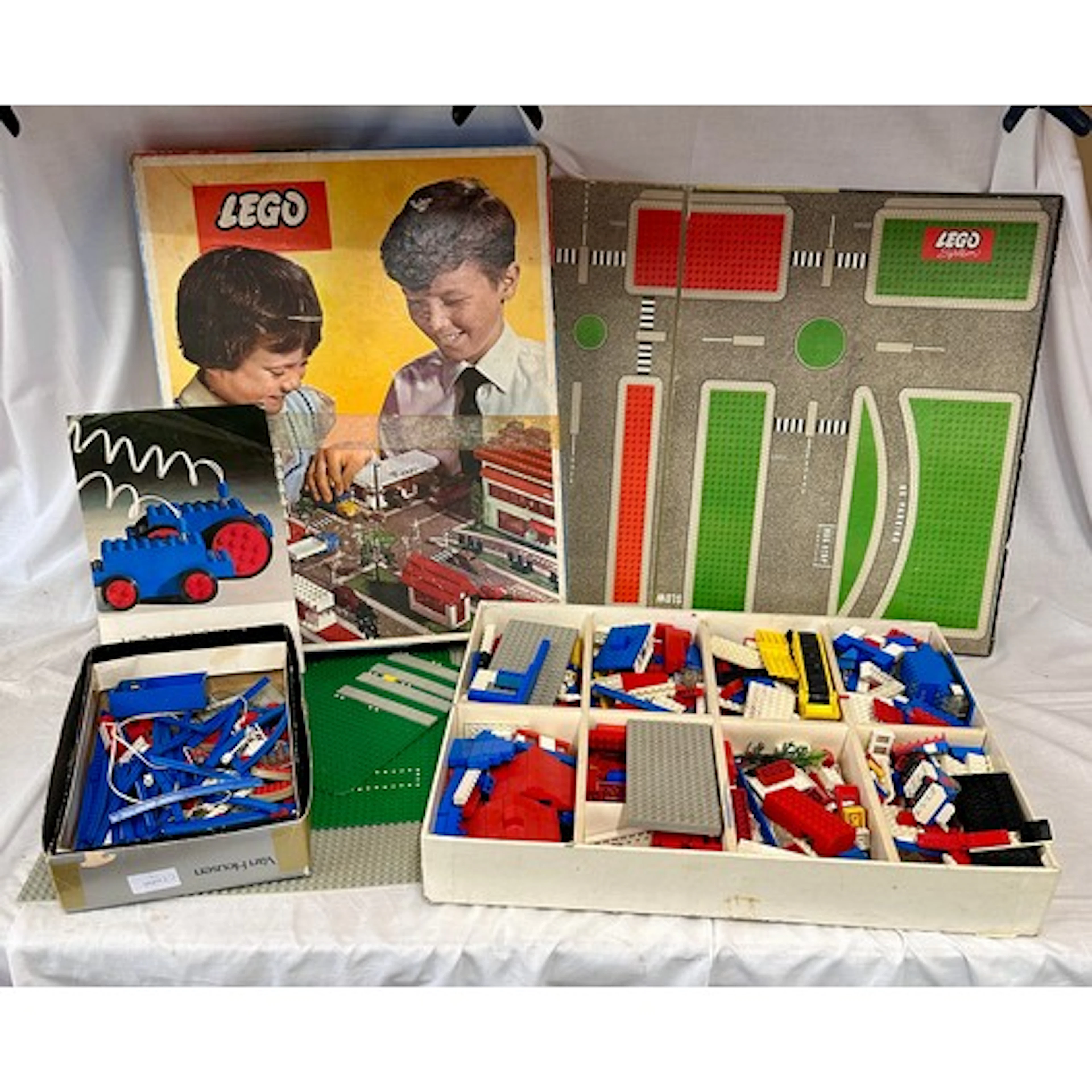 A used Lego set 810 Town Plan boxed with boards and leaflets...