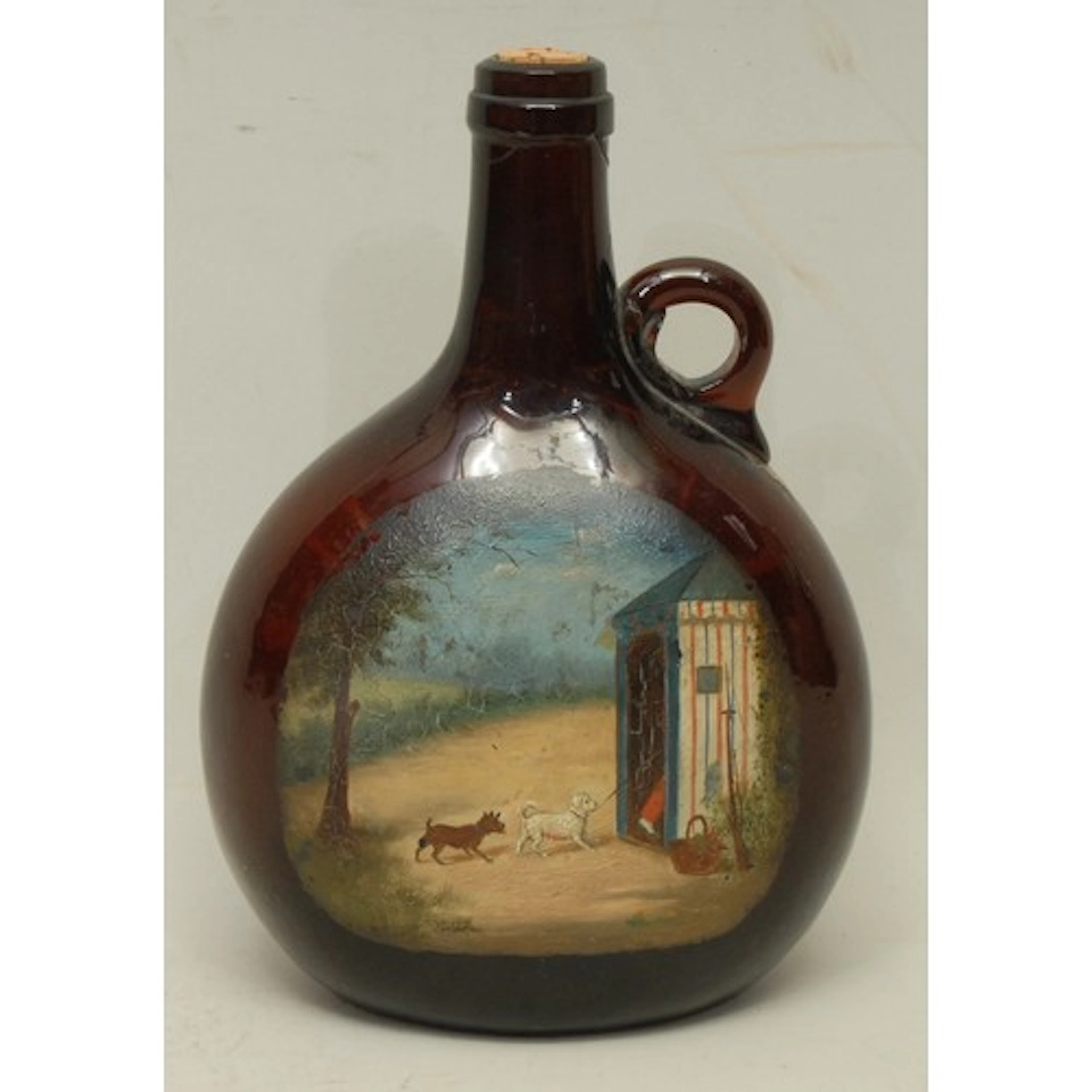 Folk Art - an early 19th century amber/brown glass flattened...