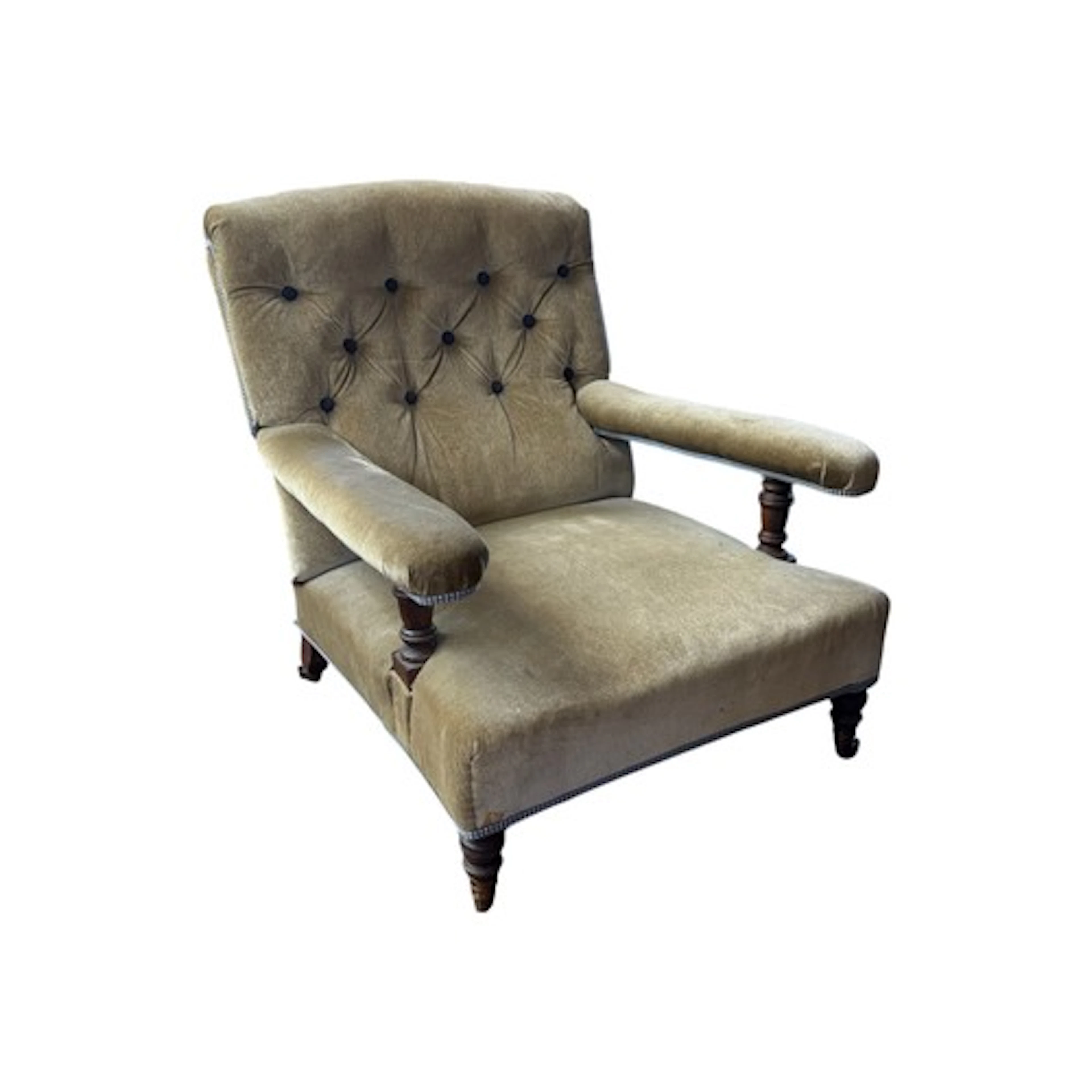 An Edwardian low mahogany open elbow chair by Howard & Sons,...