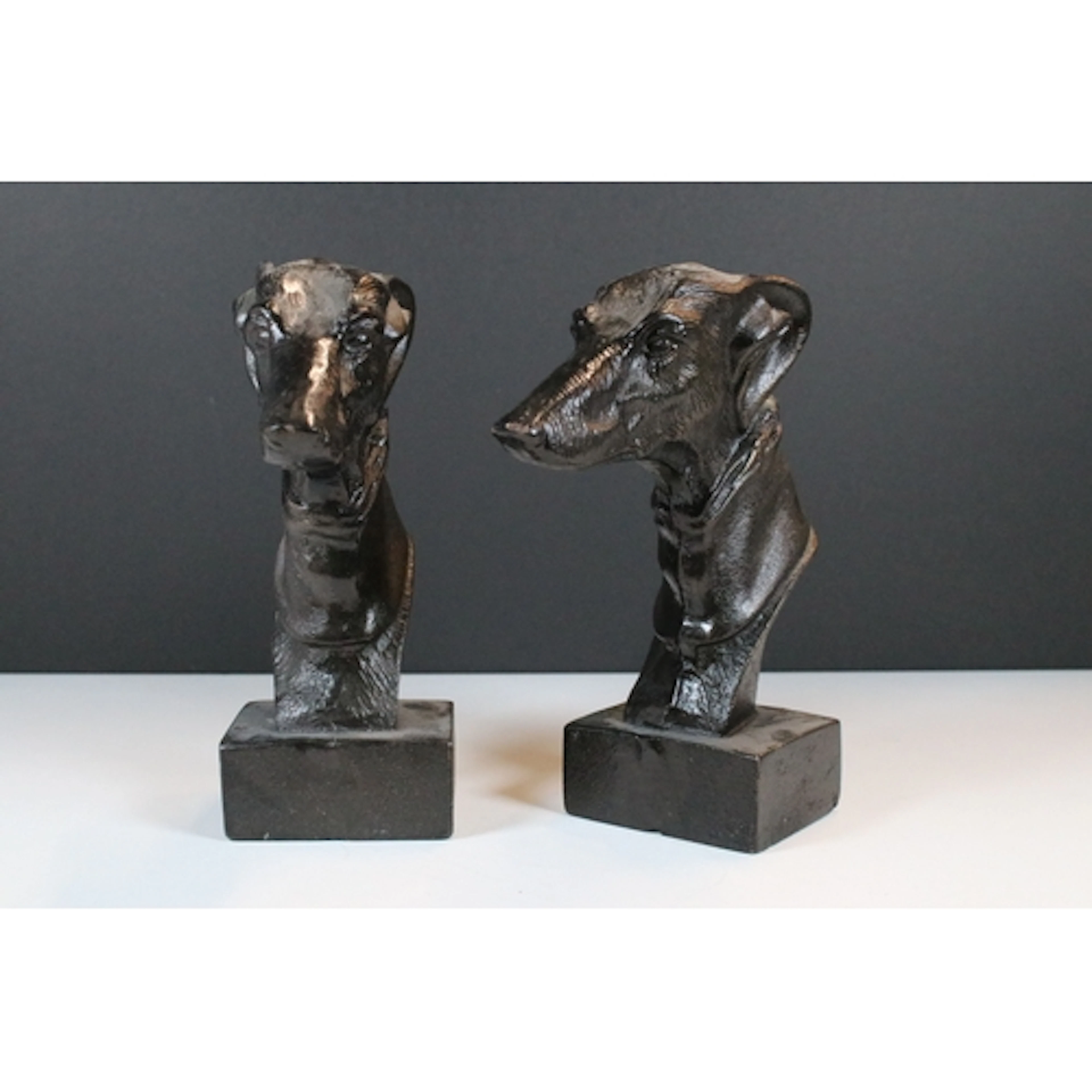 Pair of cast metal book ends, in the form of greyhound heads...