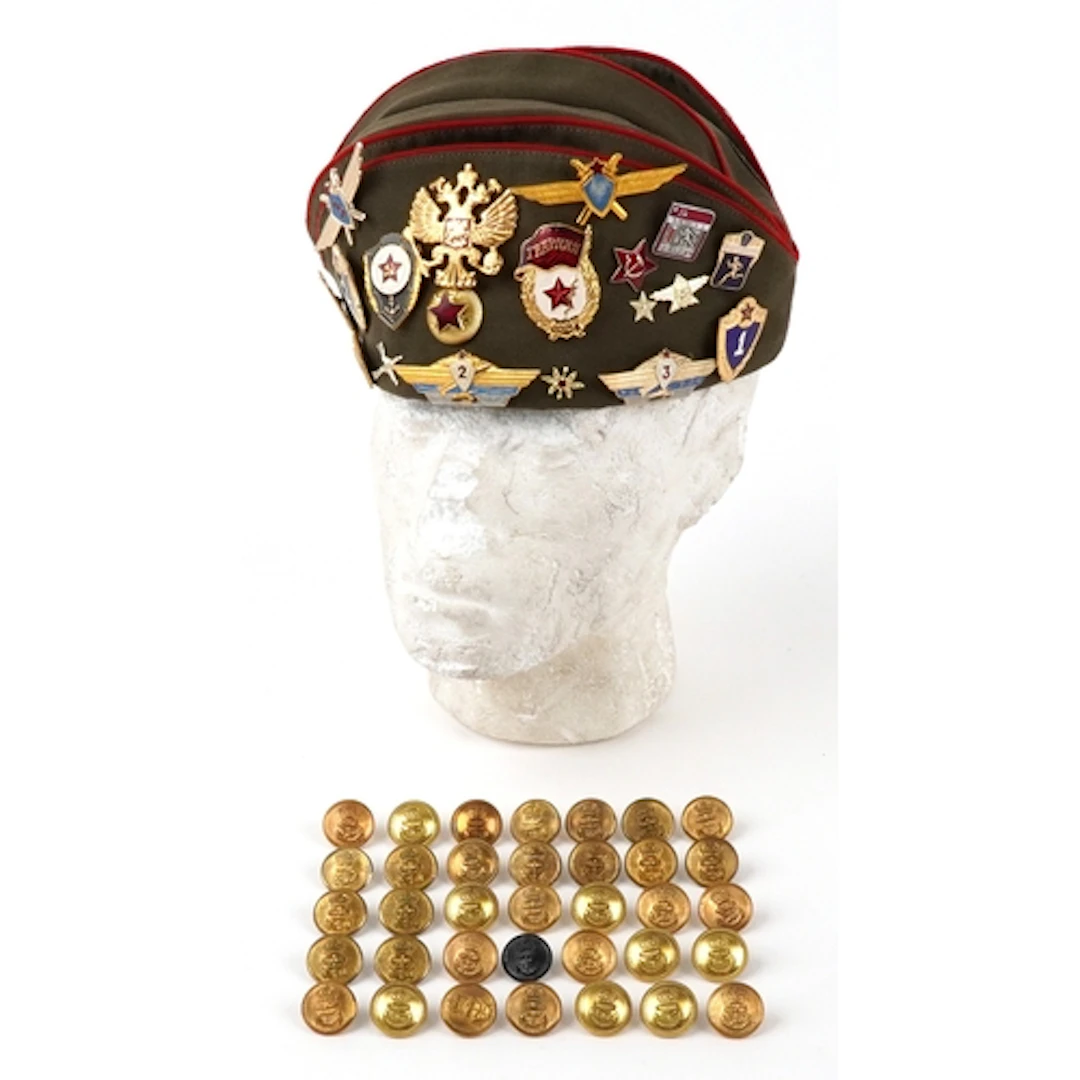 20th century Russian side cap having enamel and cloth badges...