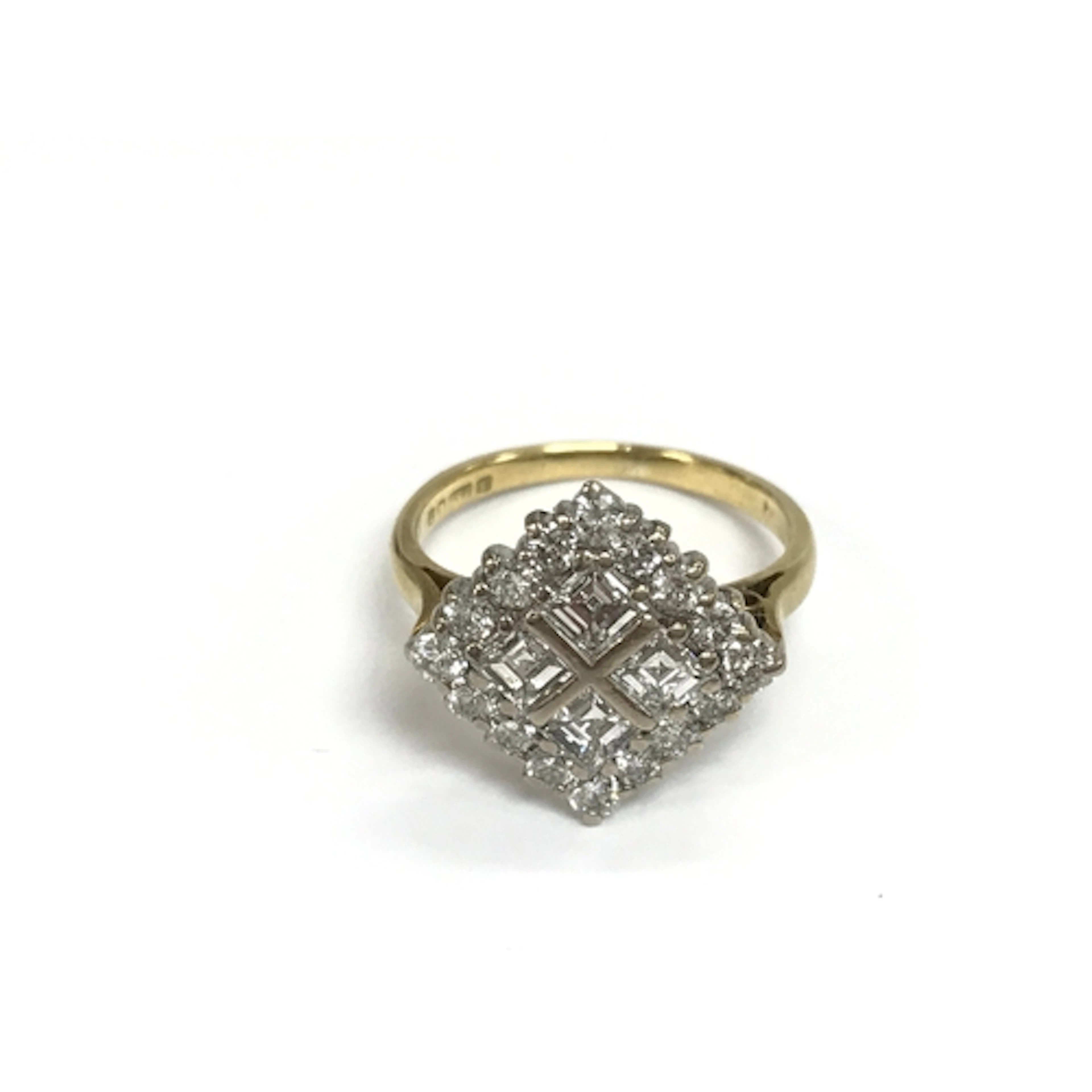 An 18ct white and yellow gold square ring set with princess ...