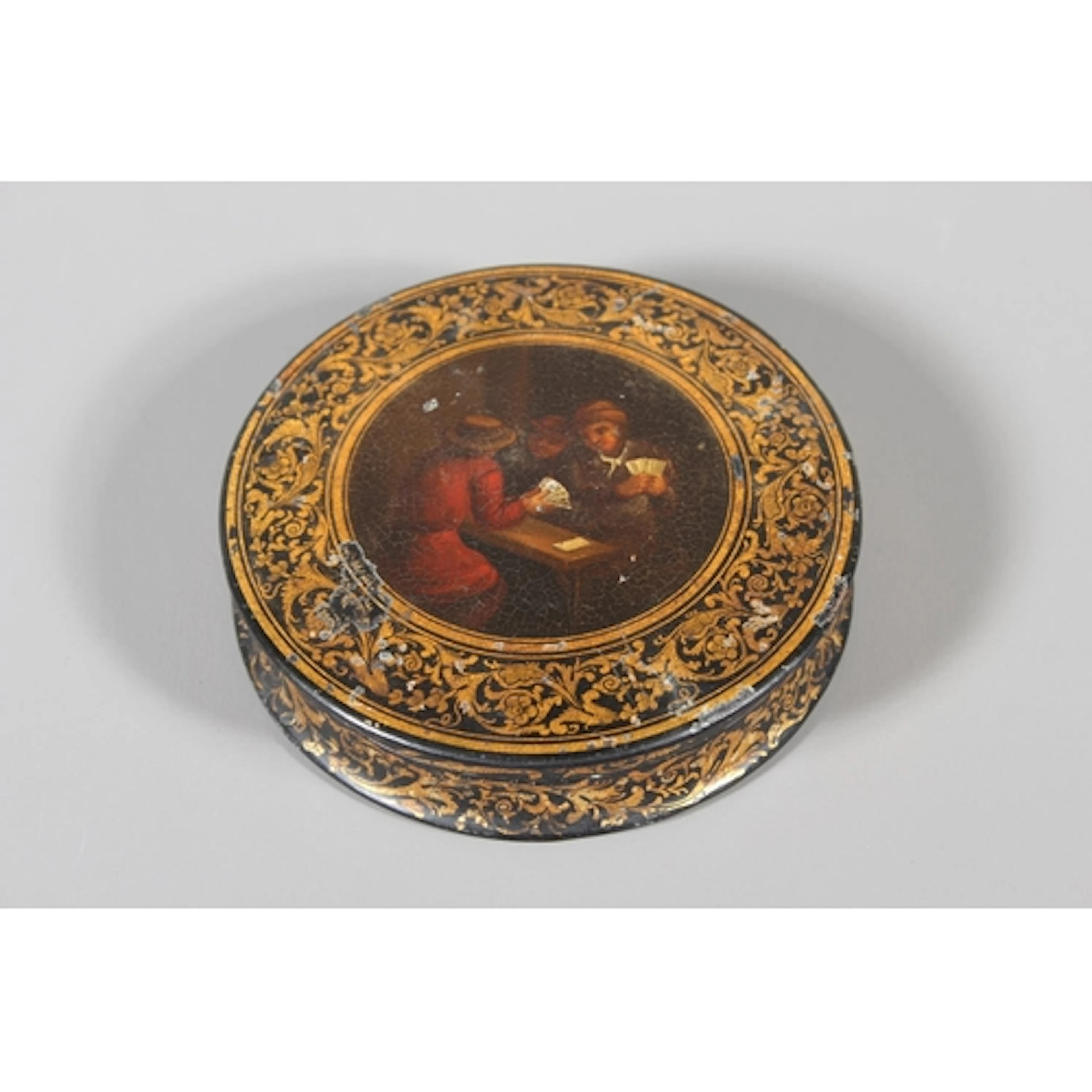 Antique black lacquered circular snuff or trinket box, the h...