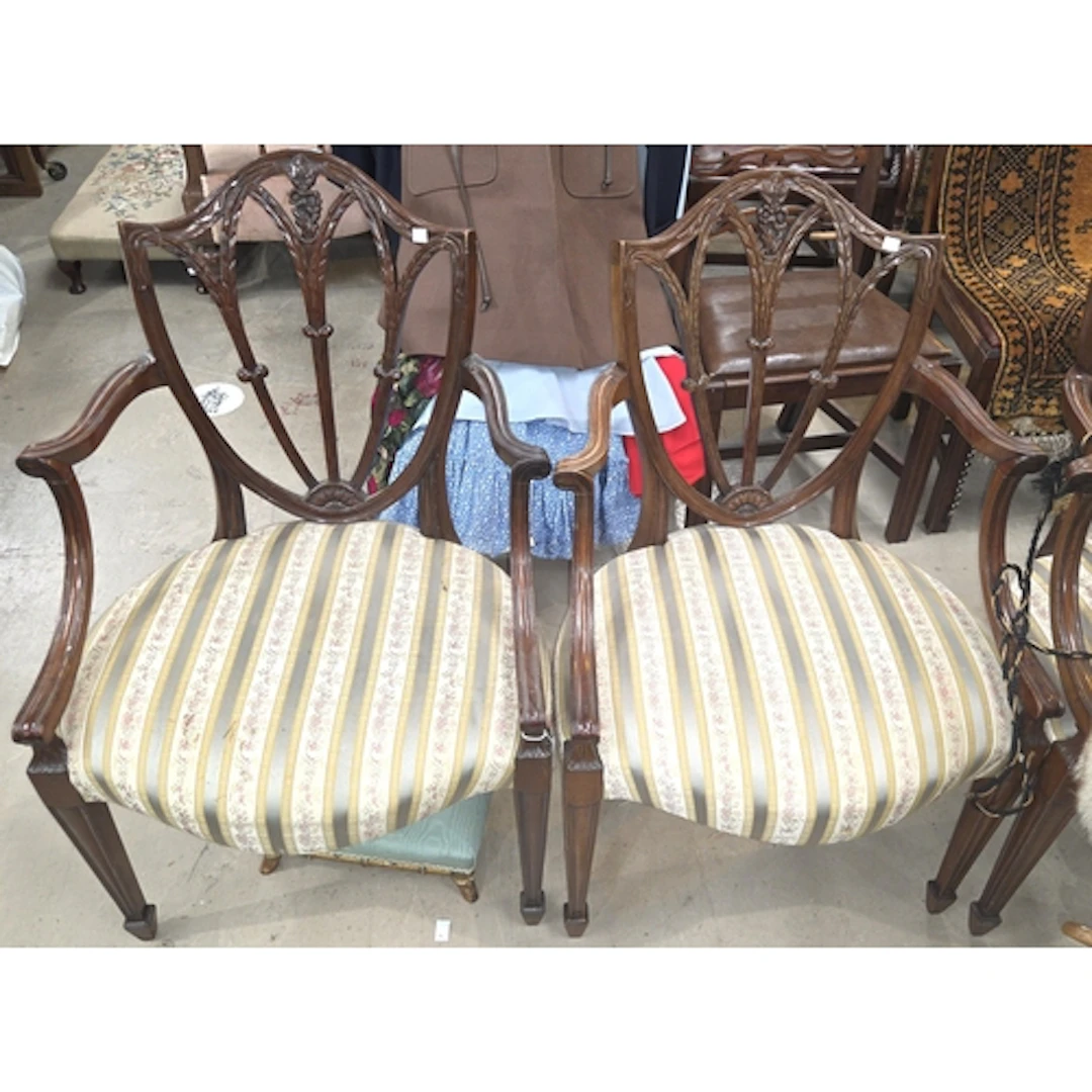 A set of four early 20th century Hepplewhite style chairs wi...
