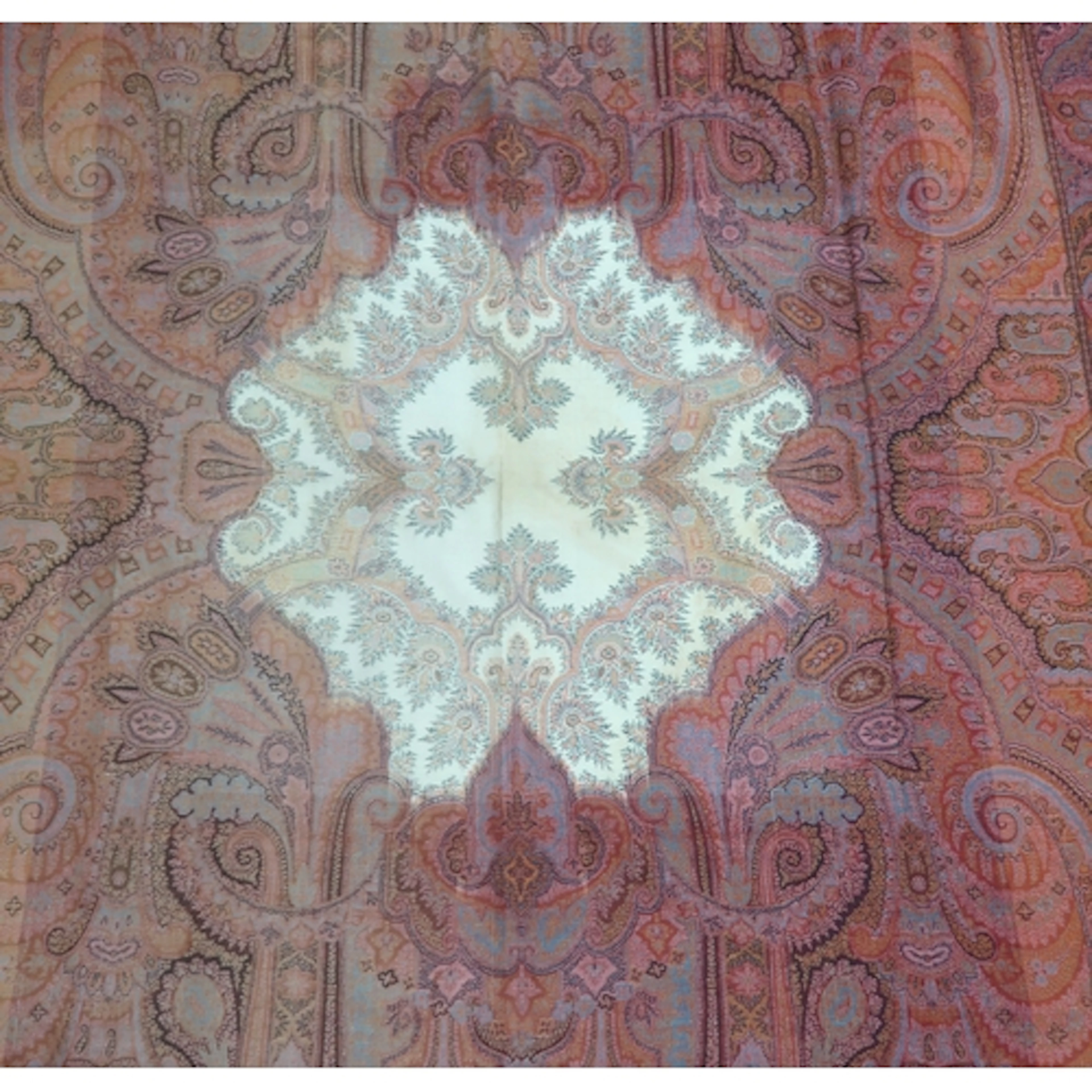 A long Paisley shawl woven in polychrome wools, the central ...