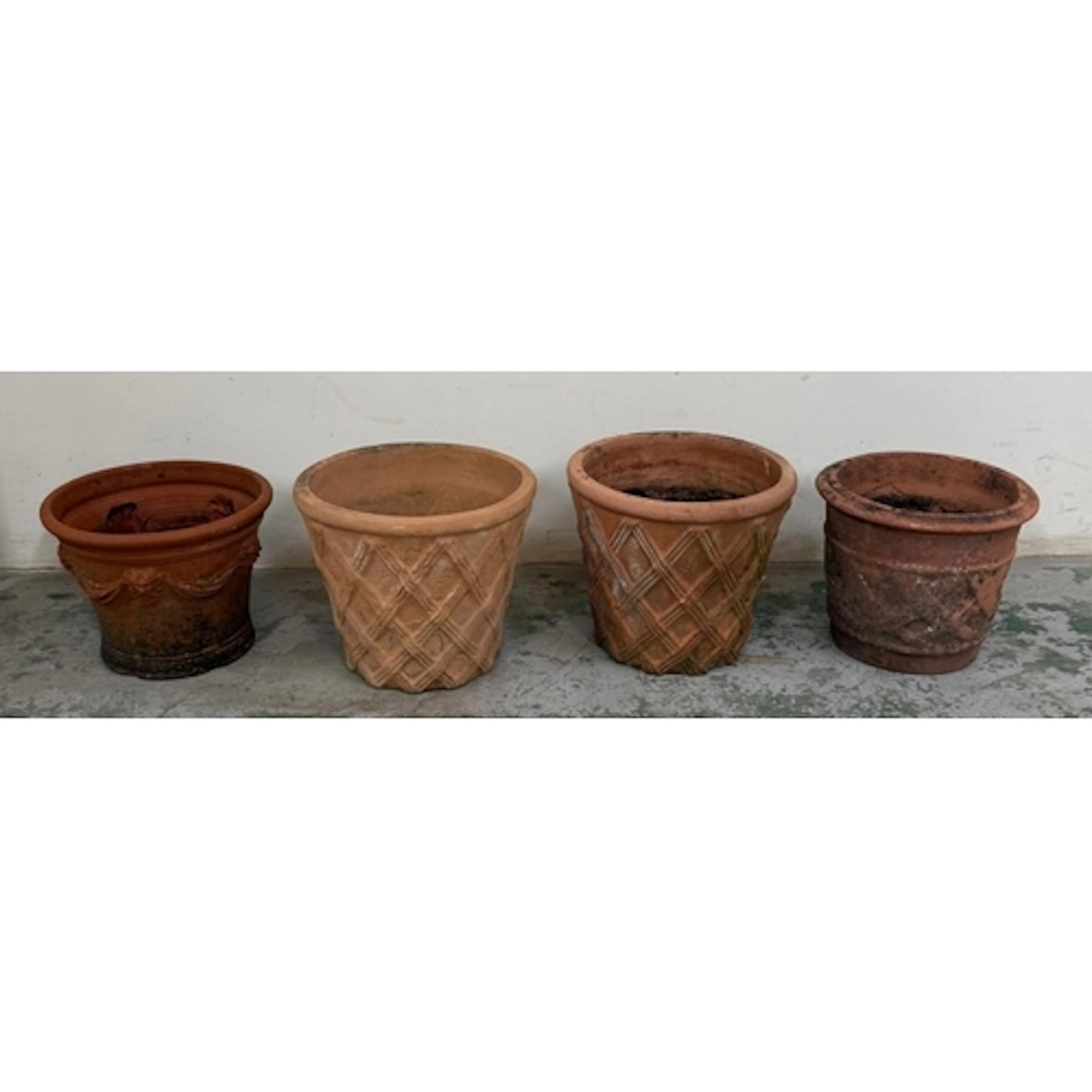 Four terracotta garden planters. Various styles.