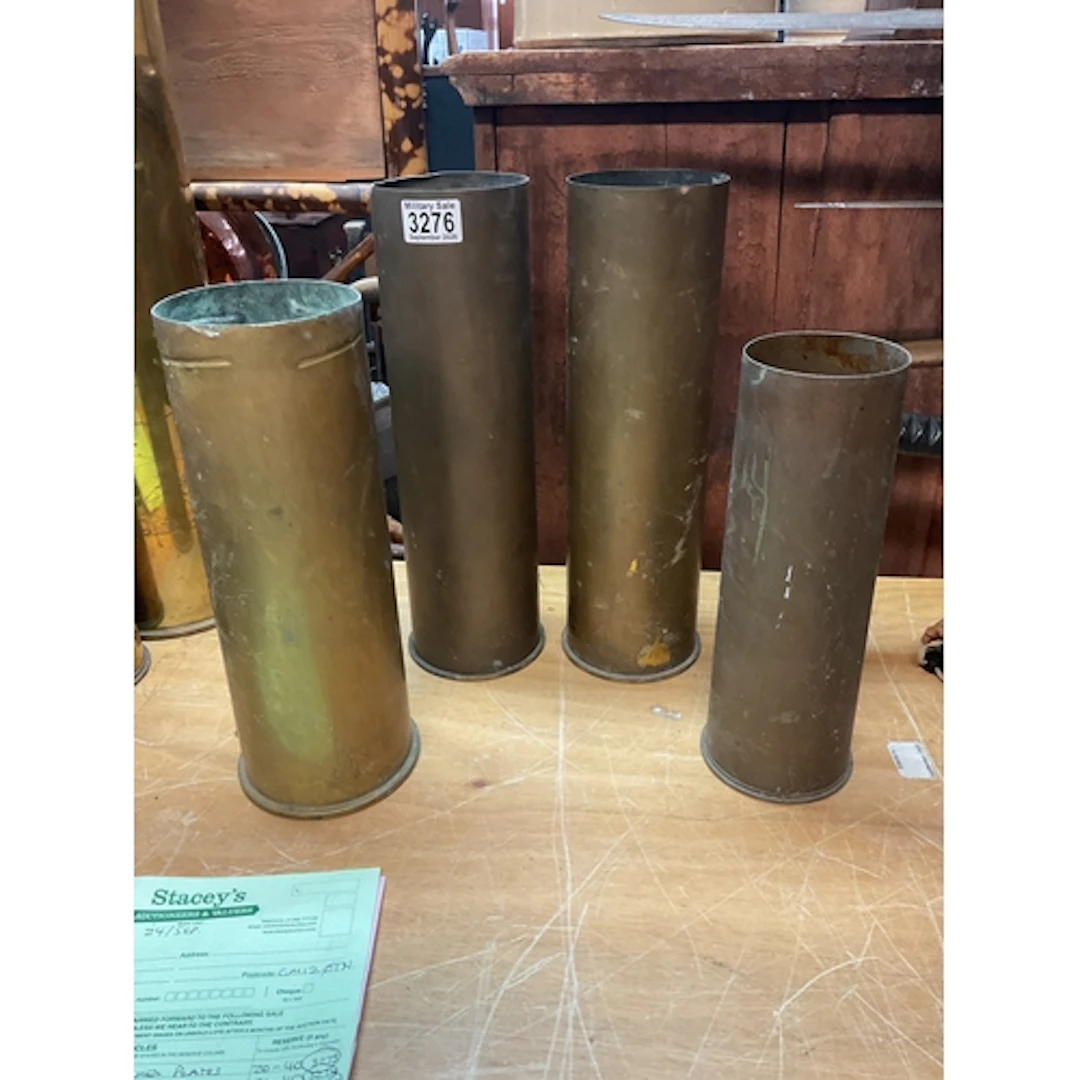 Four artillery shells, 105 etc.
