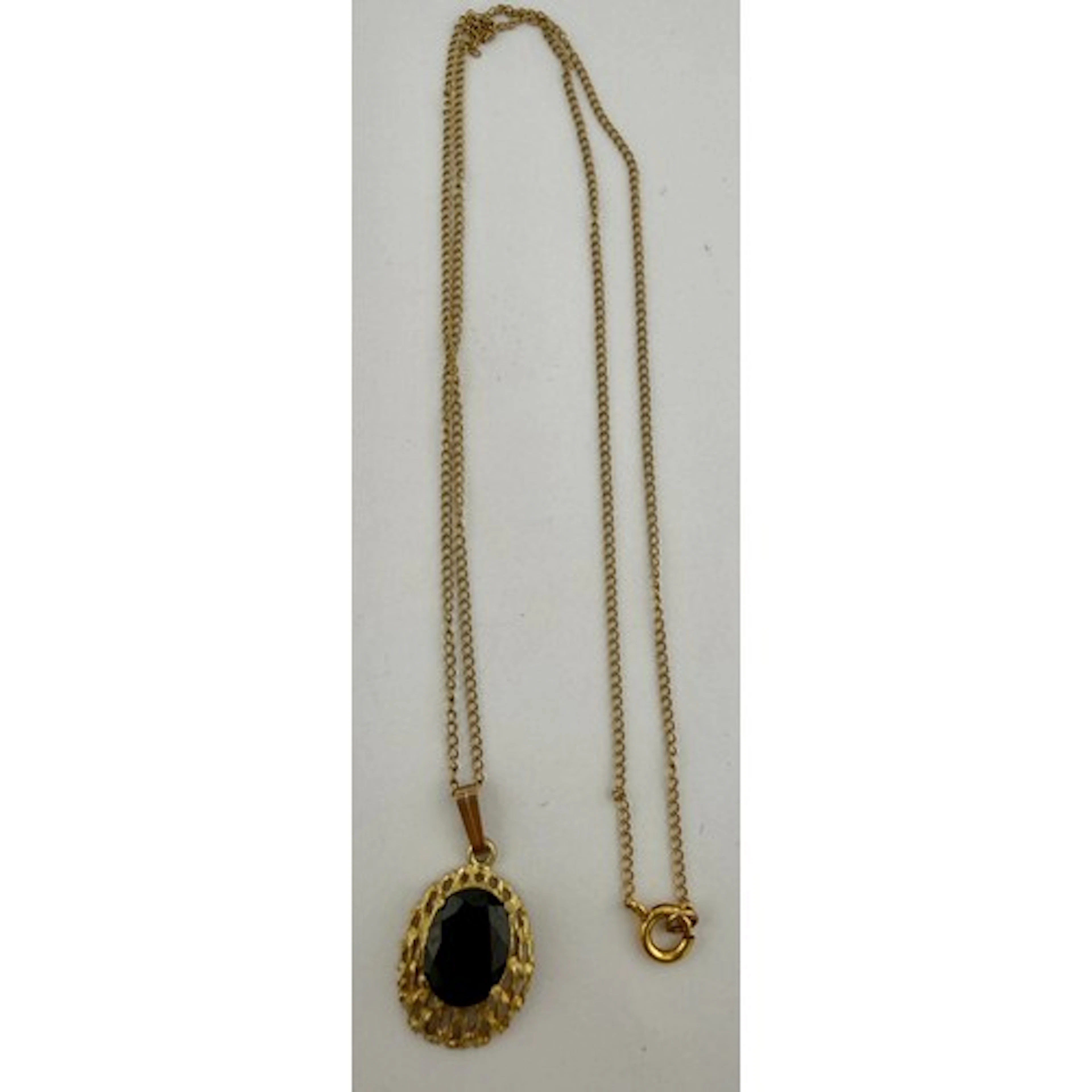 A 9 carat gold chain and pendant set with red stone. Chain 4...