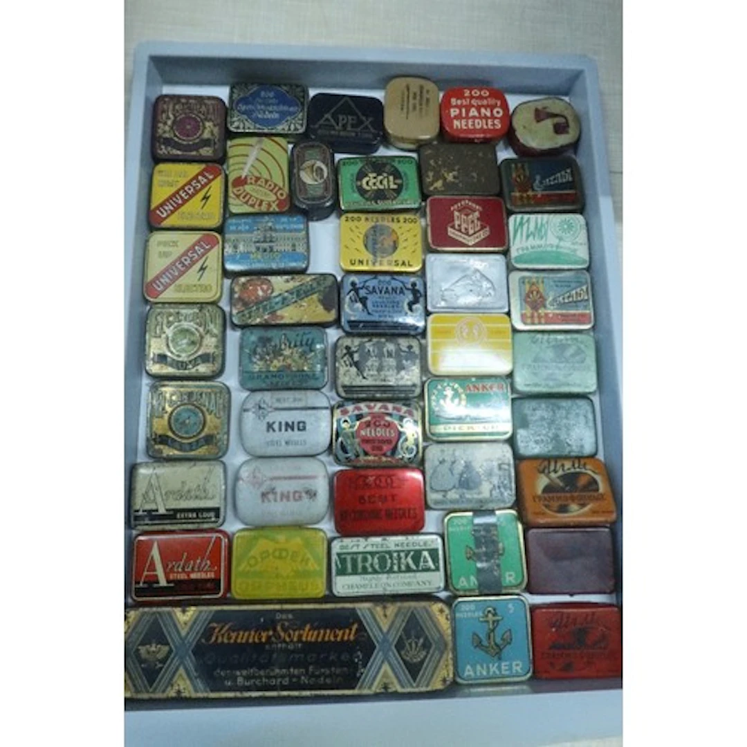 A tray of vintage gramophone needle tins