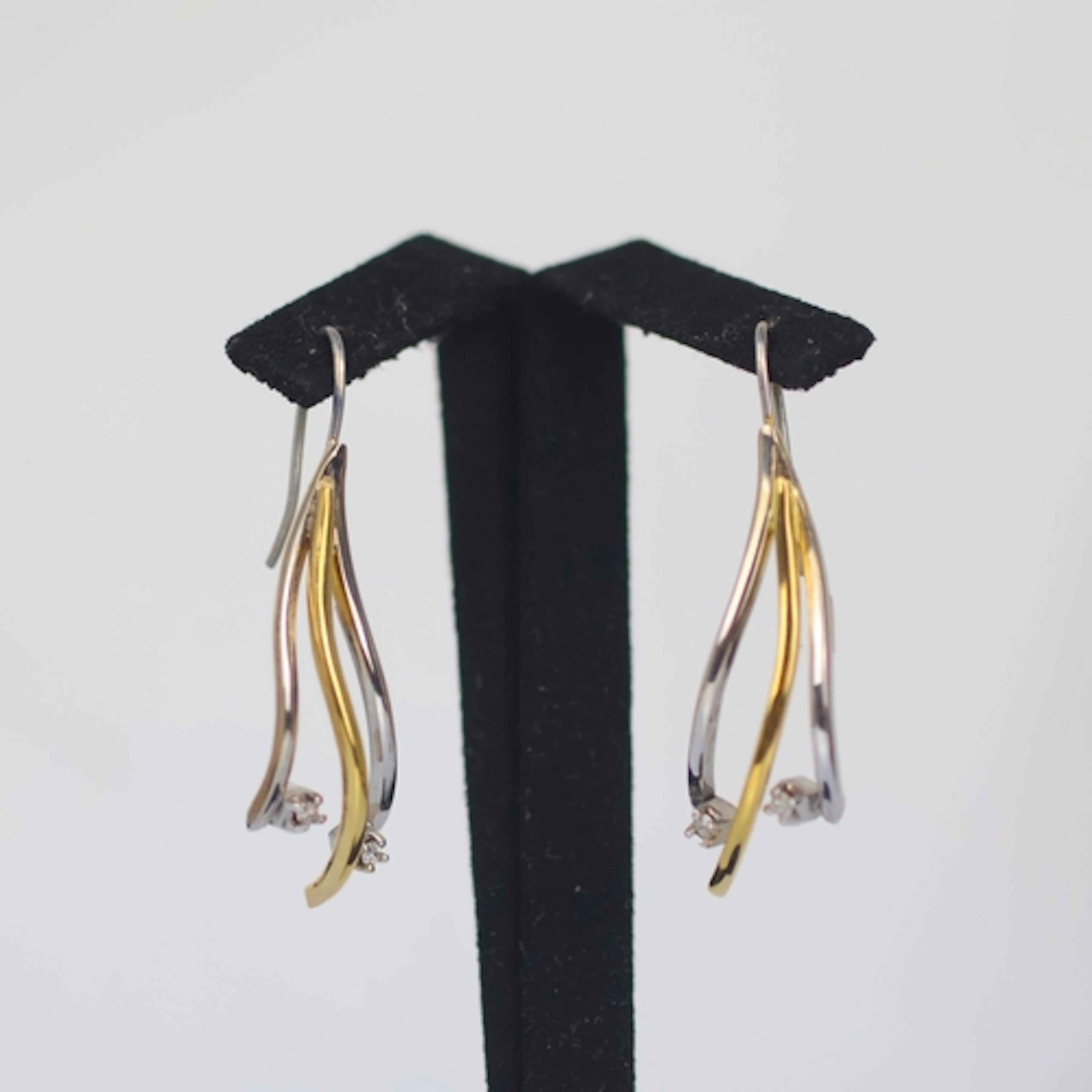 A pair of late 20th century two tone diamond set earrings, p...