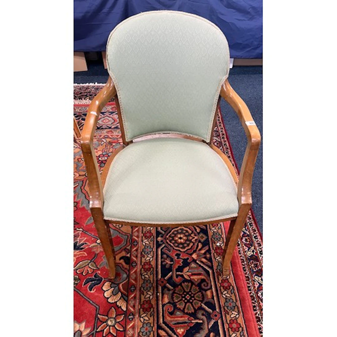 Green upholstered bedroom chair.