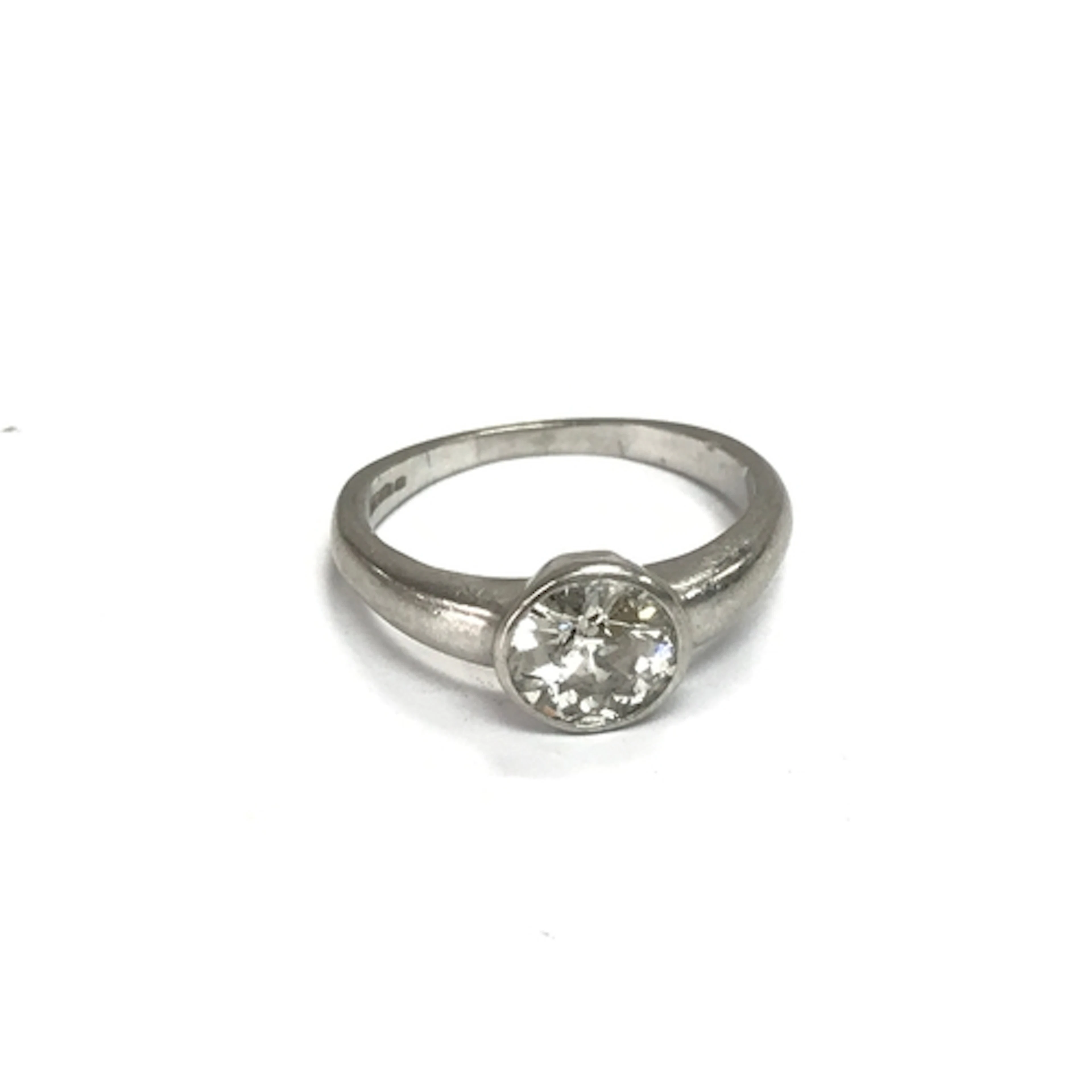 A platinum diamond solitaire ring. Stone approximately 1ct r...