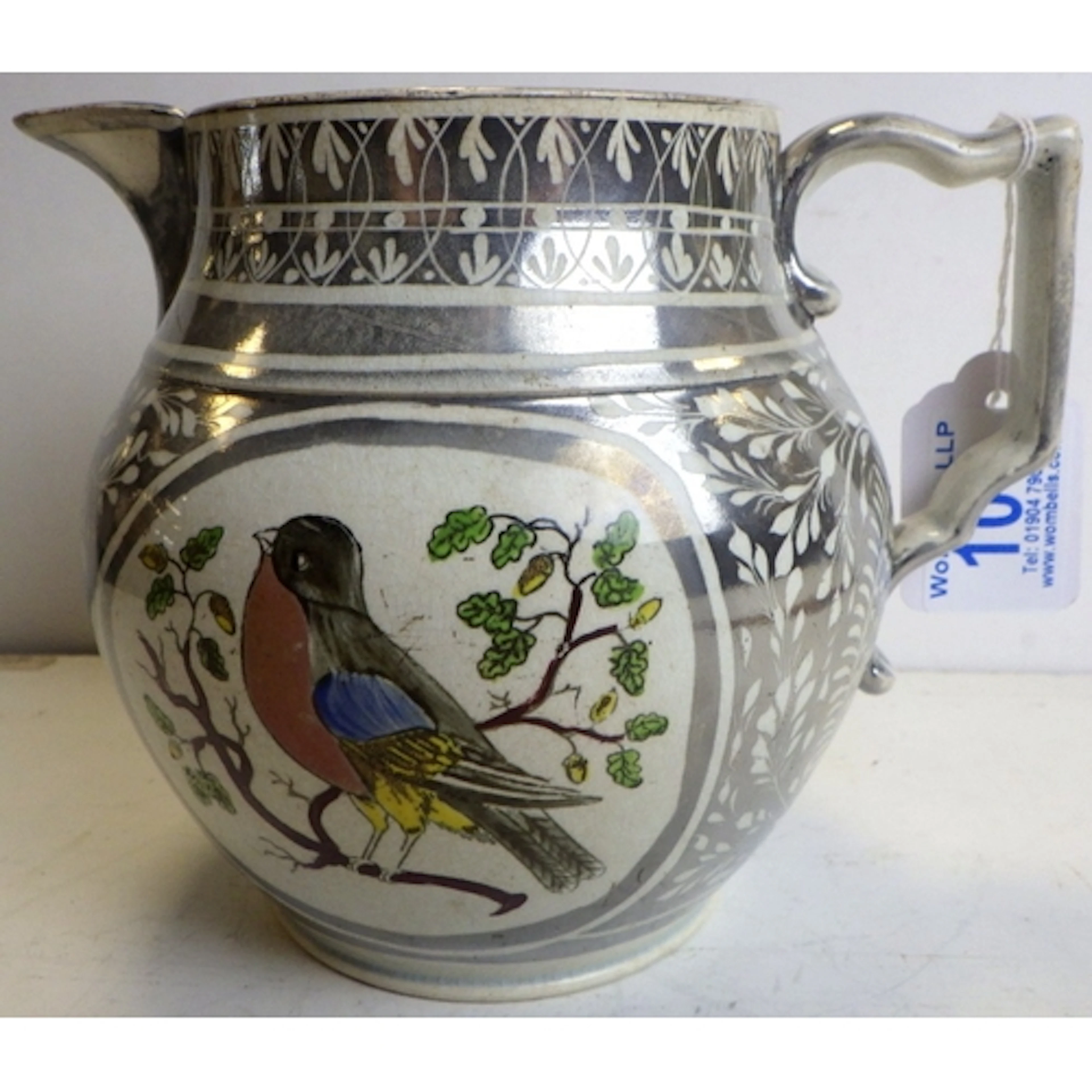 A silver lustre pottery pitcher, early 19th century, with en...