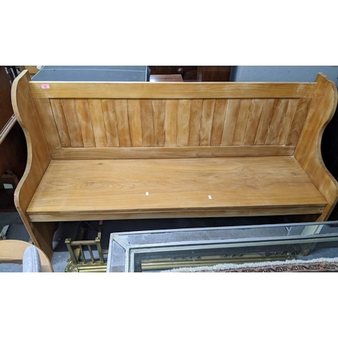A stained light oak pew, 92 x 151 x 51cms. Location: G If t...