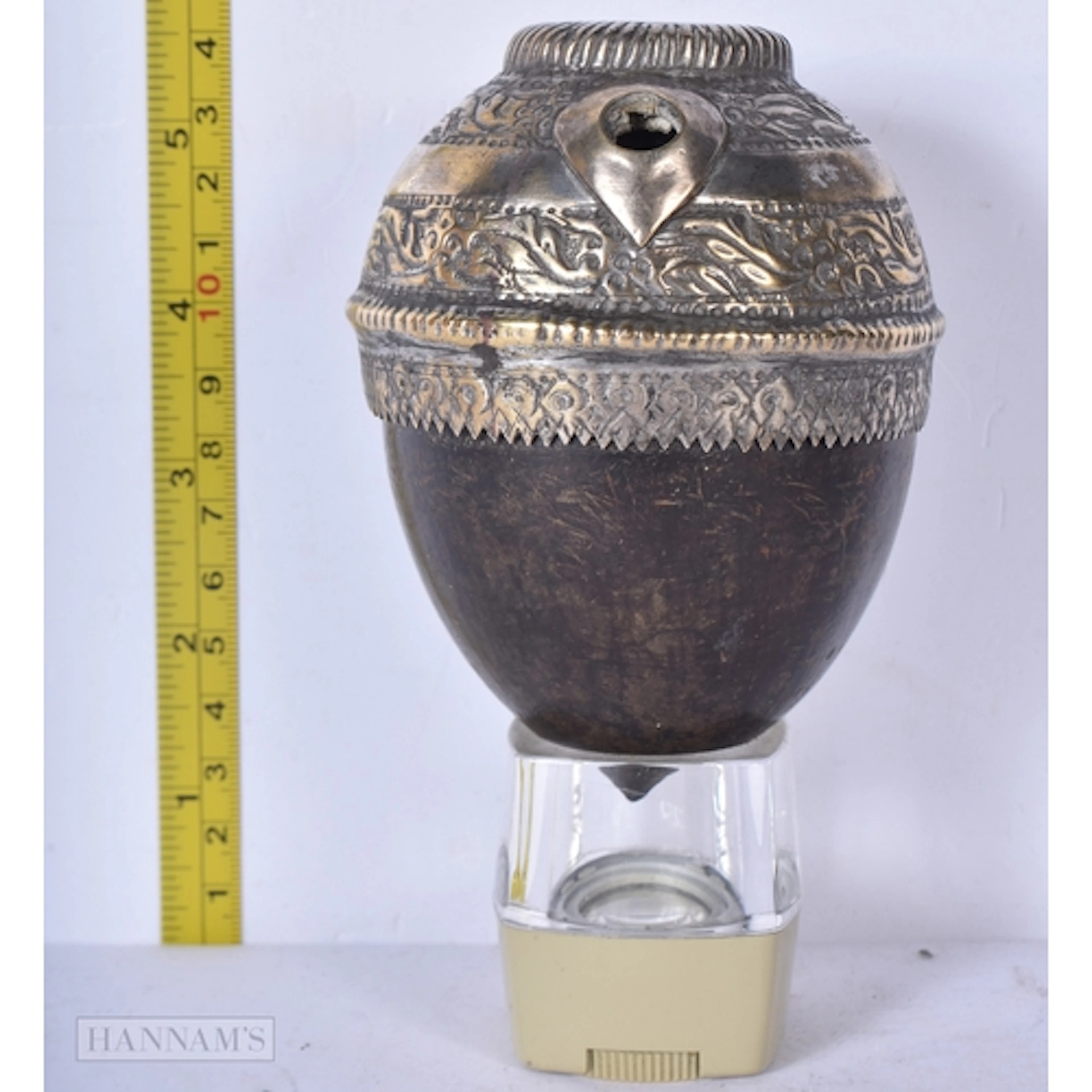A 19th Century Persian hookah base formed from a large nut k...