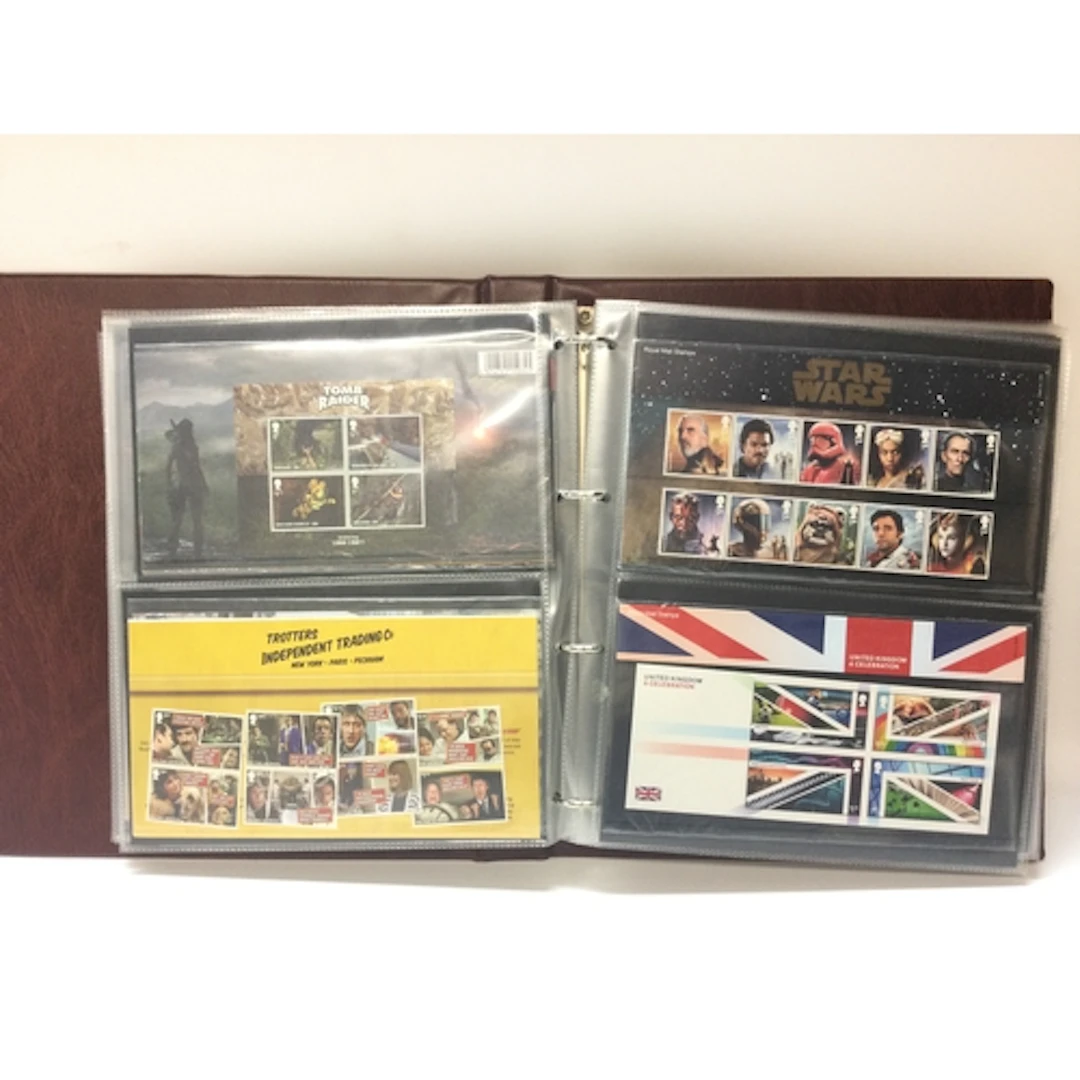 7 Queen Elizabeth II Royal Mail presentation covers filled w...
