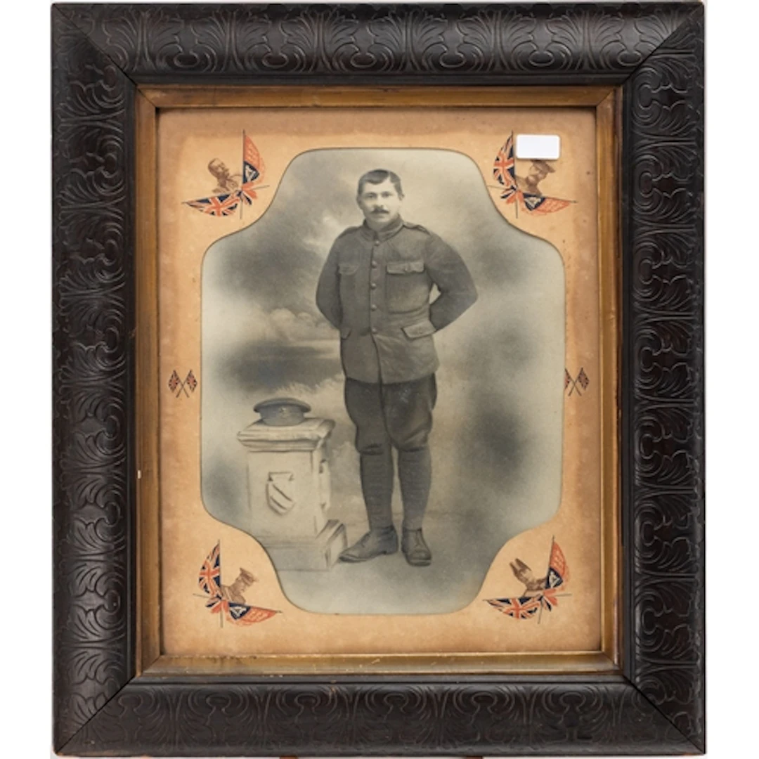 A WWI War Badge, number 214993, together with a brass trench...