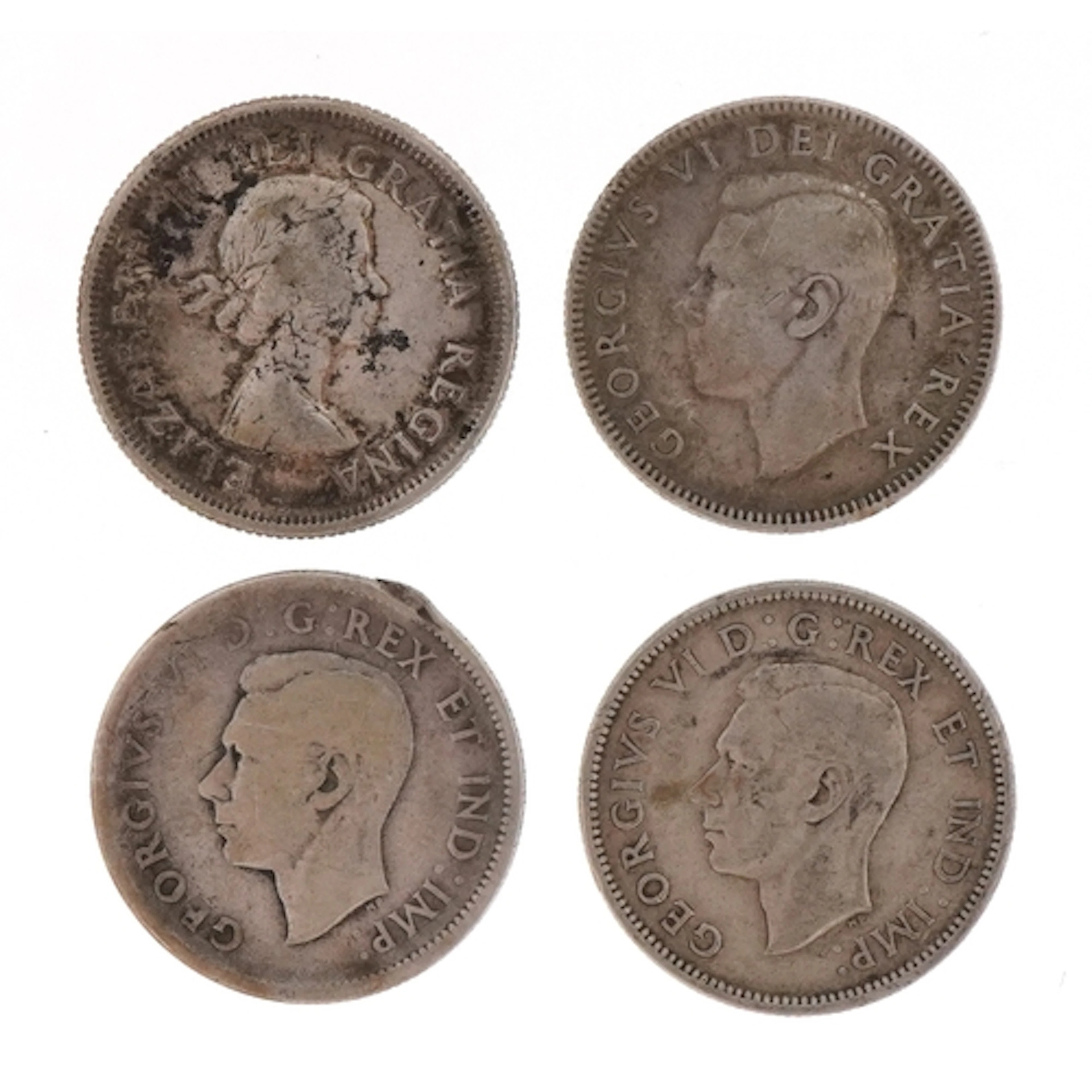 Four Canadian moose head silver twenty five cents coins, dat...