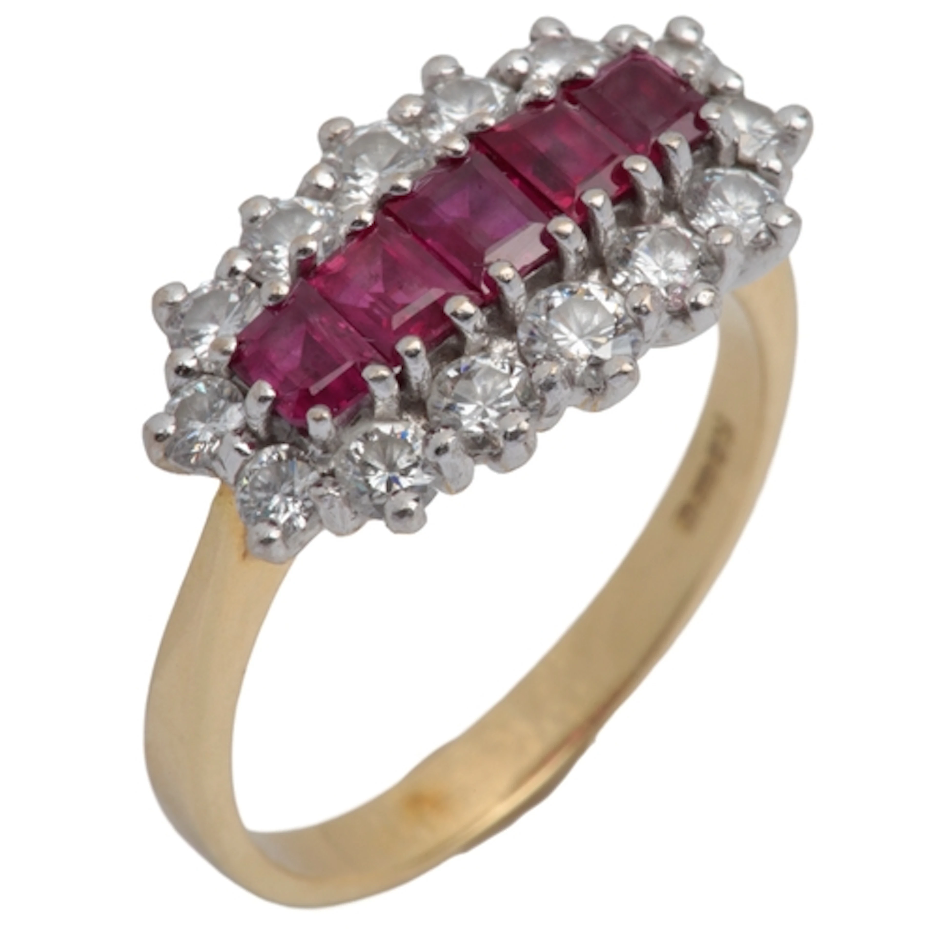 A ruby and diamond ring, centring on a line of calibré-cut r...