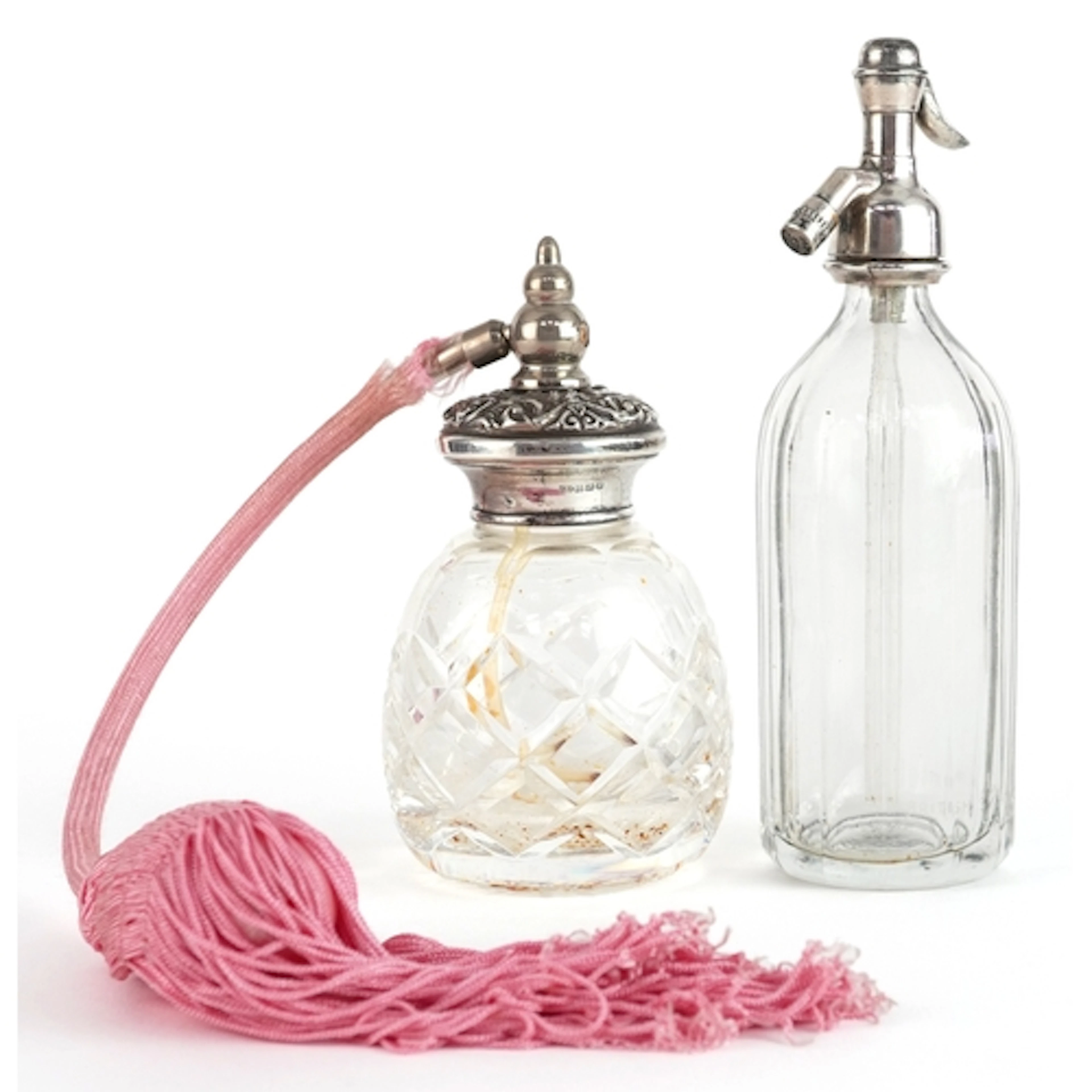 Silver mounted cut glass atomiser perfume bottles, one in th...