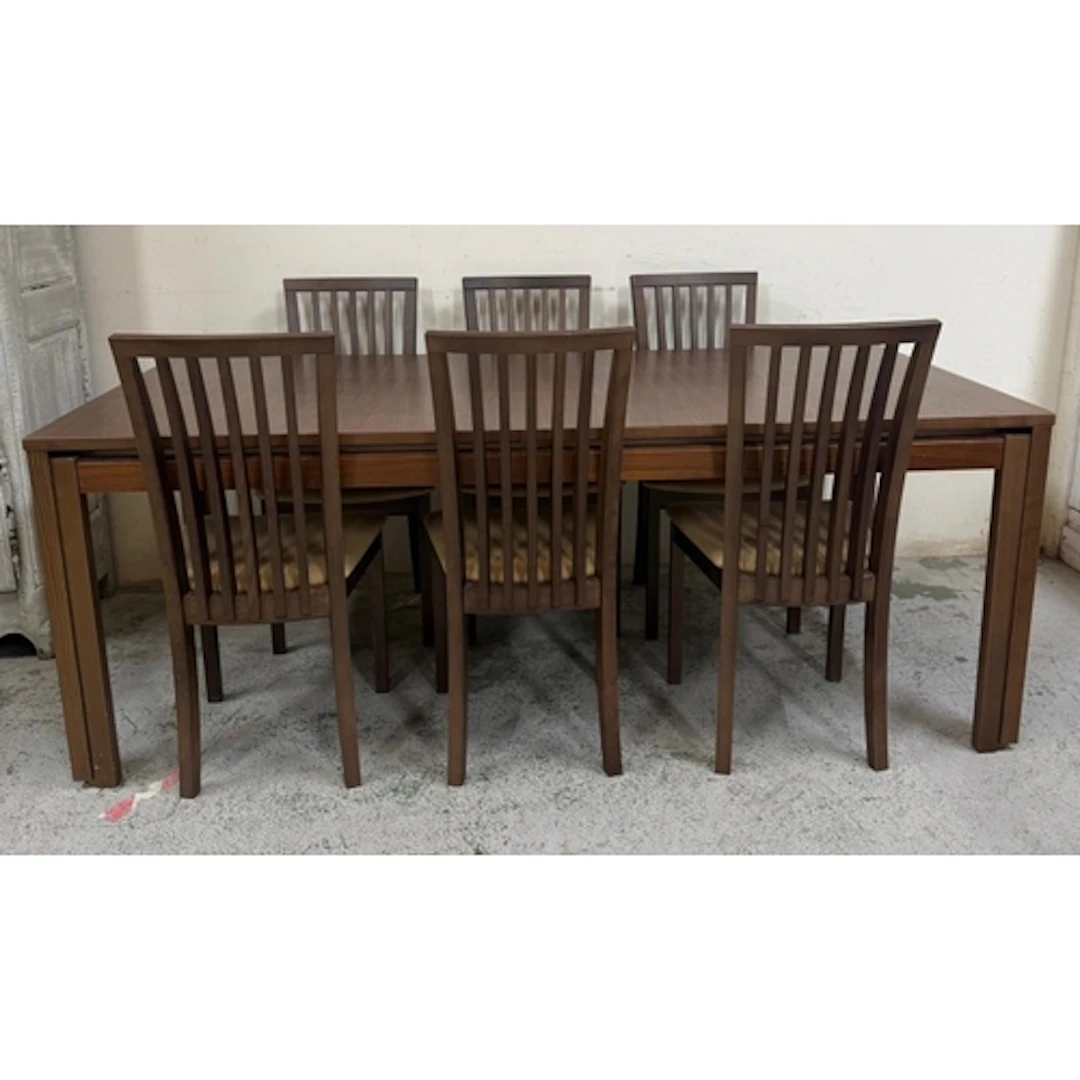 A Skovby extendable dining table with three leaves and six S...