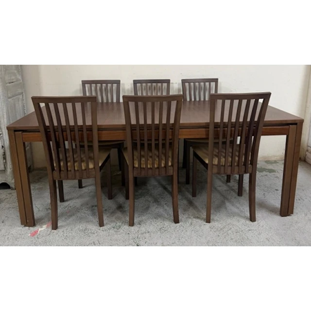 A Skovby extendable dining table with three leaves and six S...
