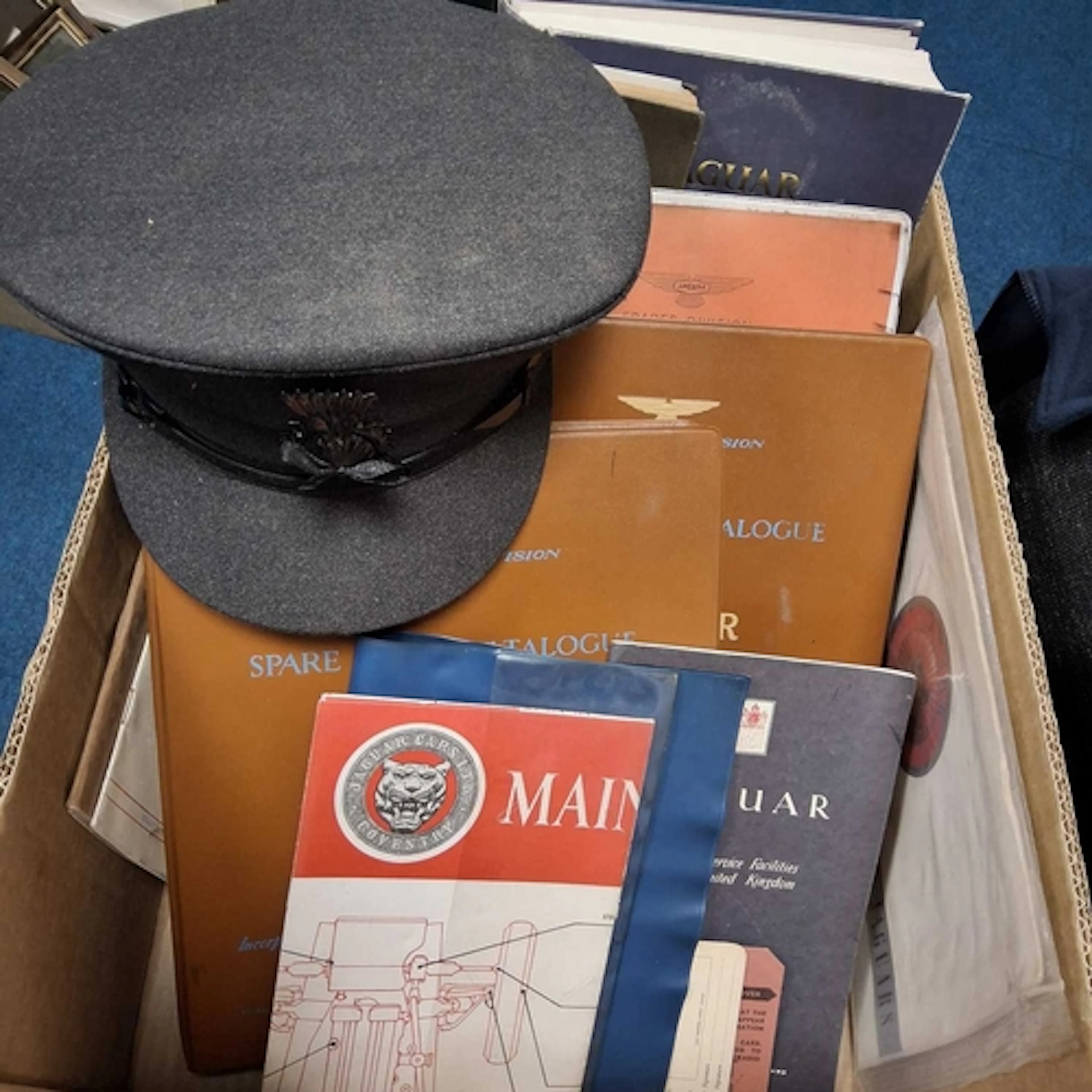 A BOX OF MOTOR CAR MEMORABILIA MOSTLY JAGUAR, to include a t...