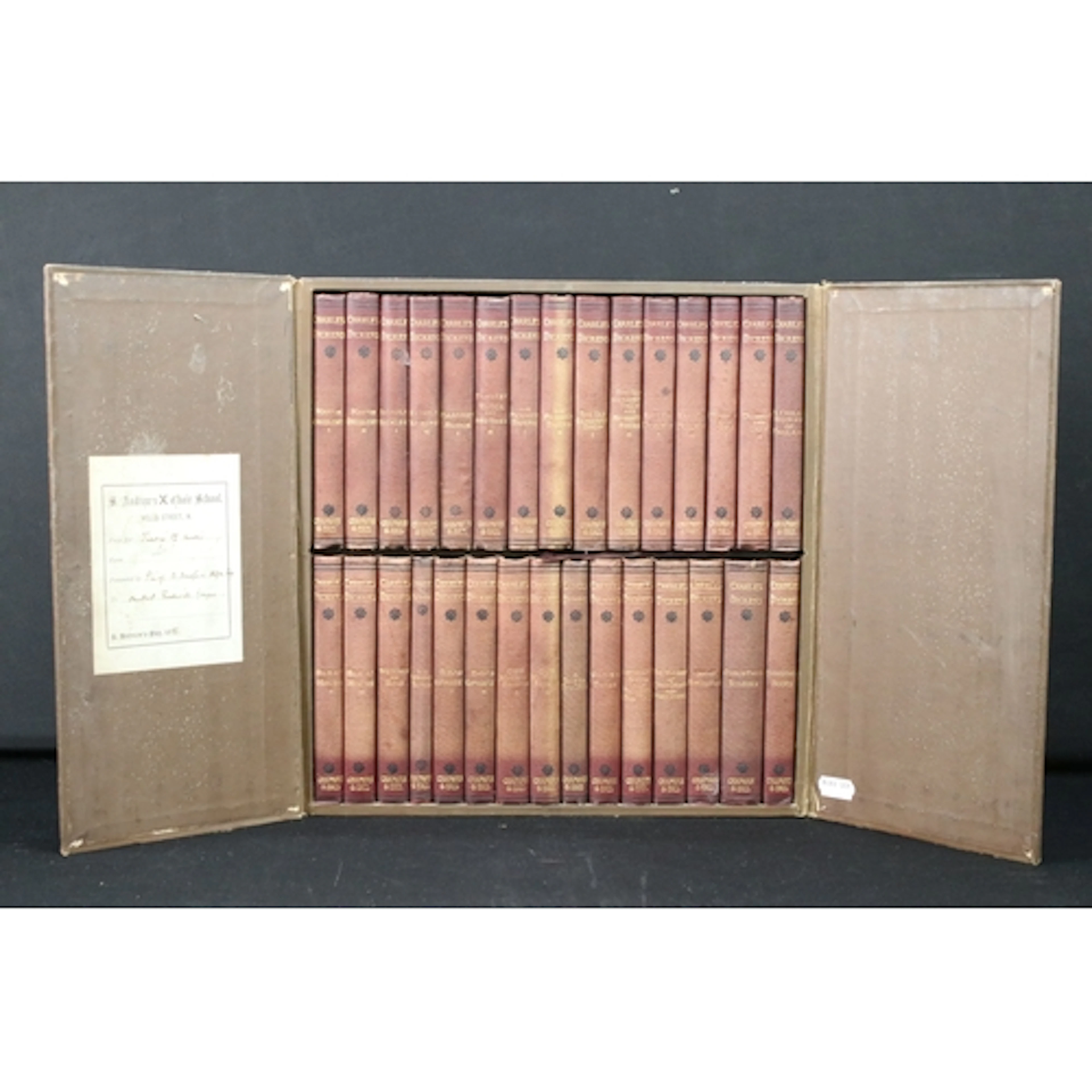 The works of Charles Dickens, 30 pocket volumes within fitte...