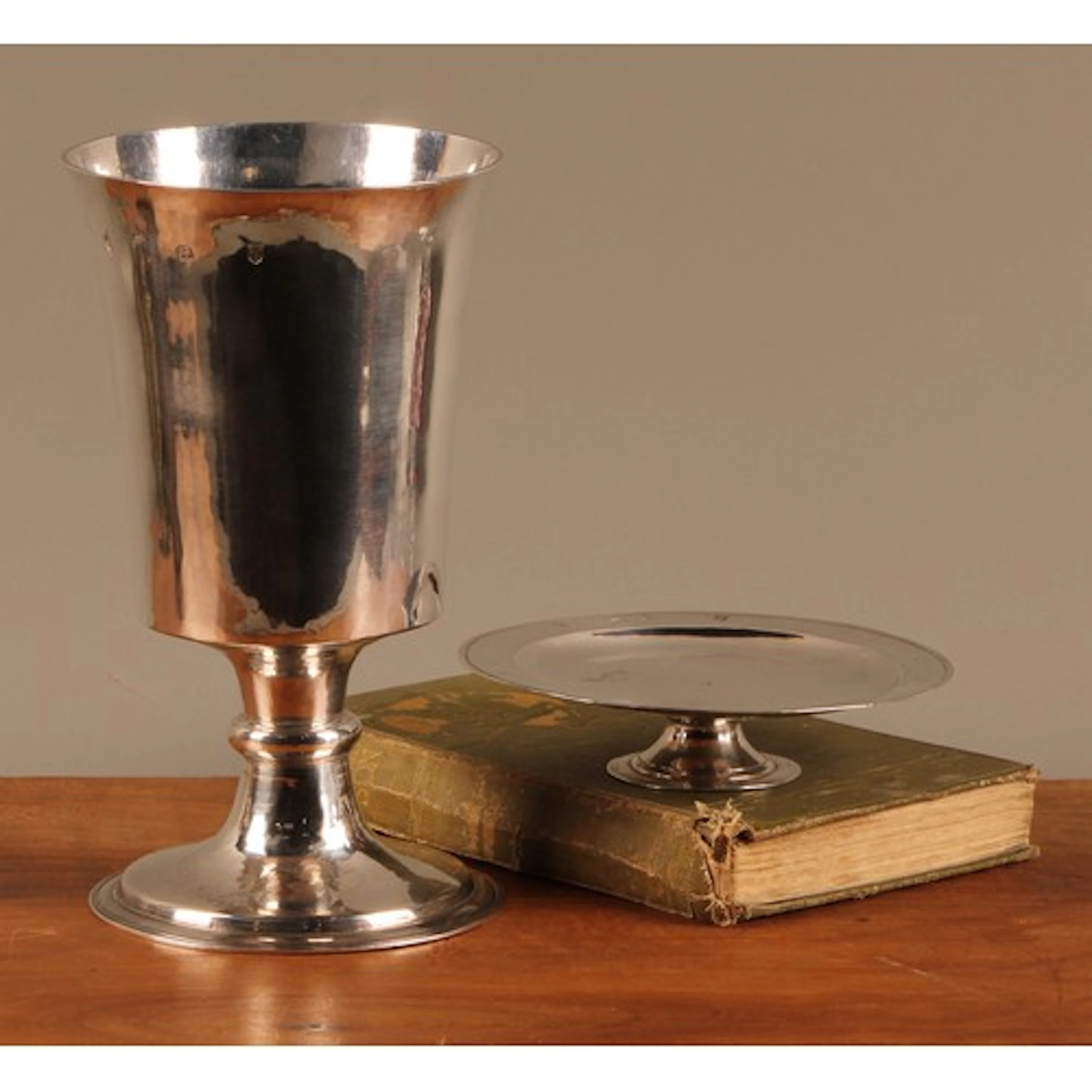 A Charles I silver bell shaped communion chalice and paten, ...