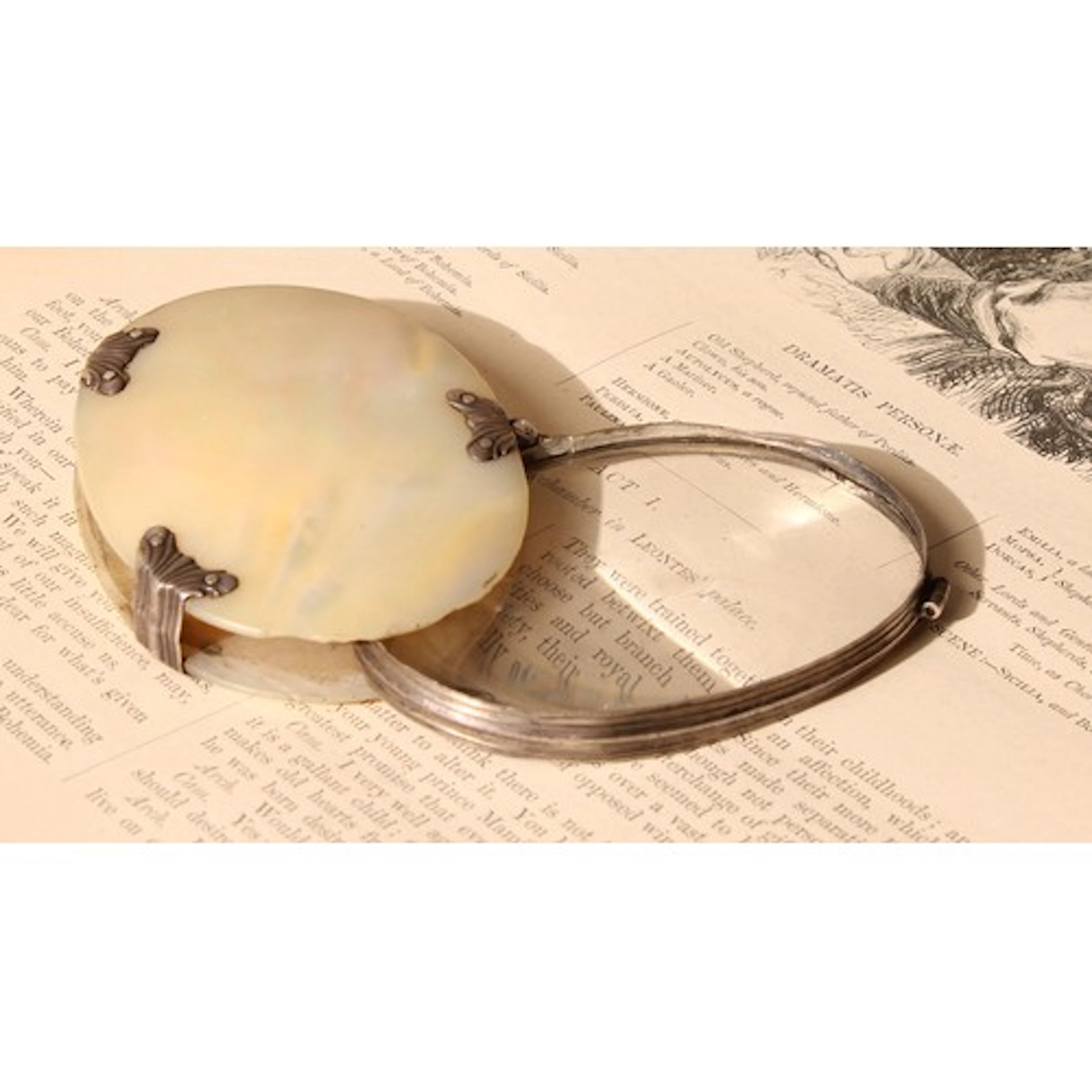 A George III silver and mother of pearl folding pocket lens,...