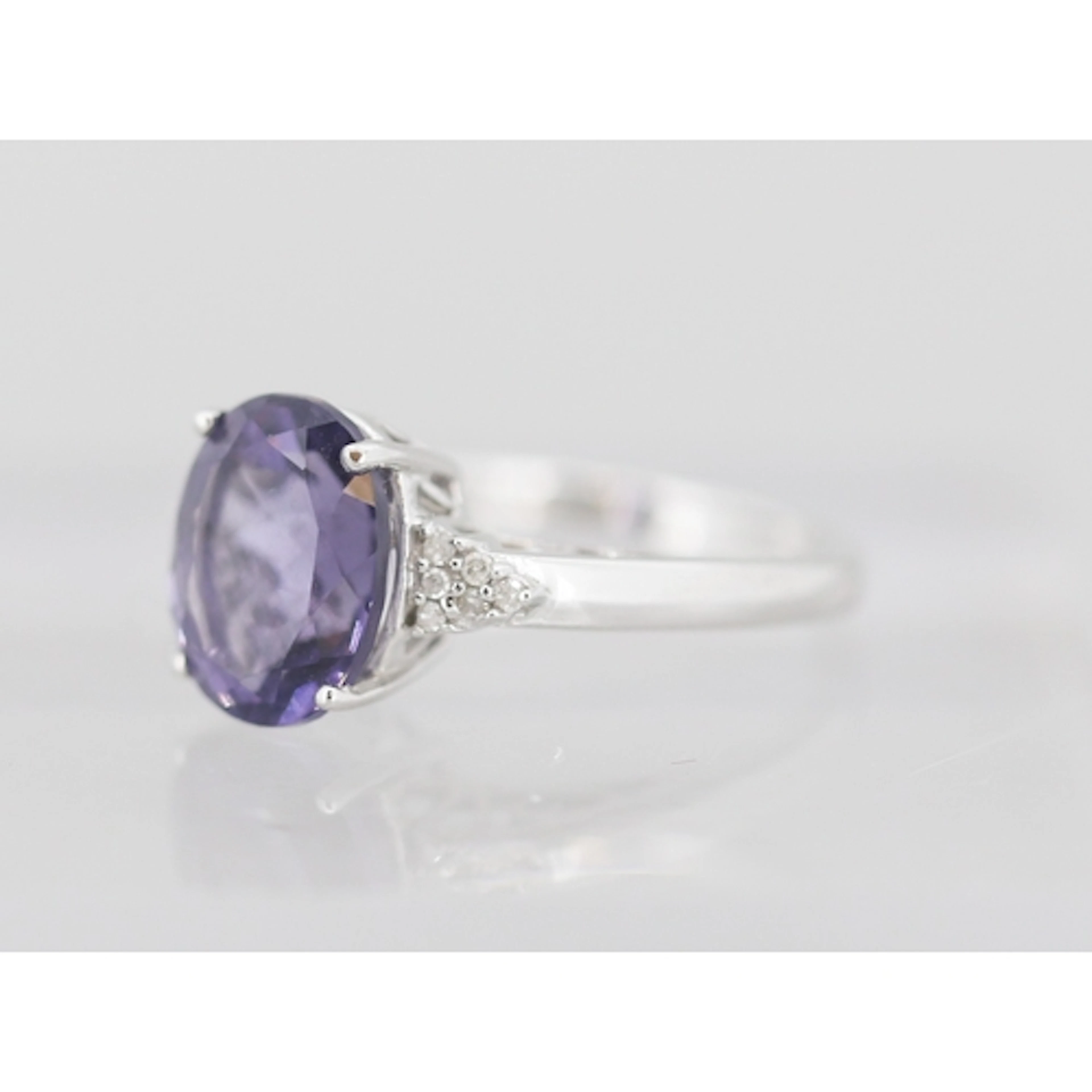 Iolite Set Ring with Six Stone Diamond Clusters Set to Shoul...