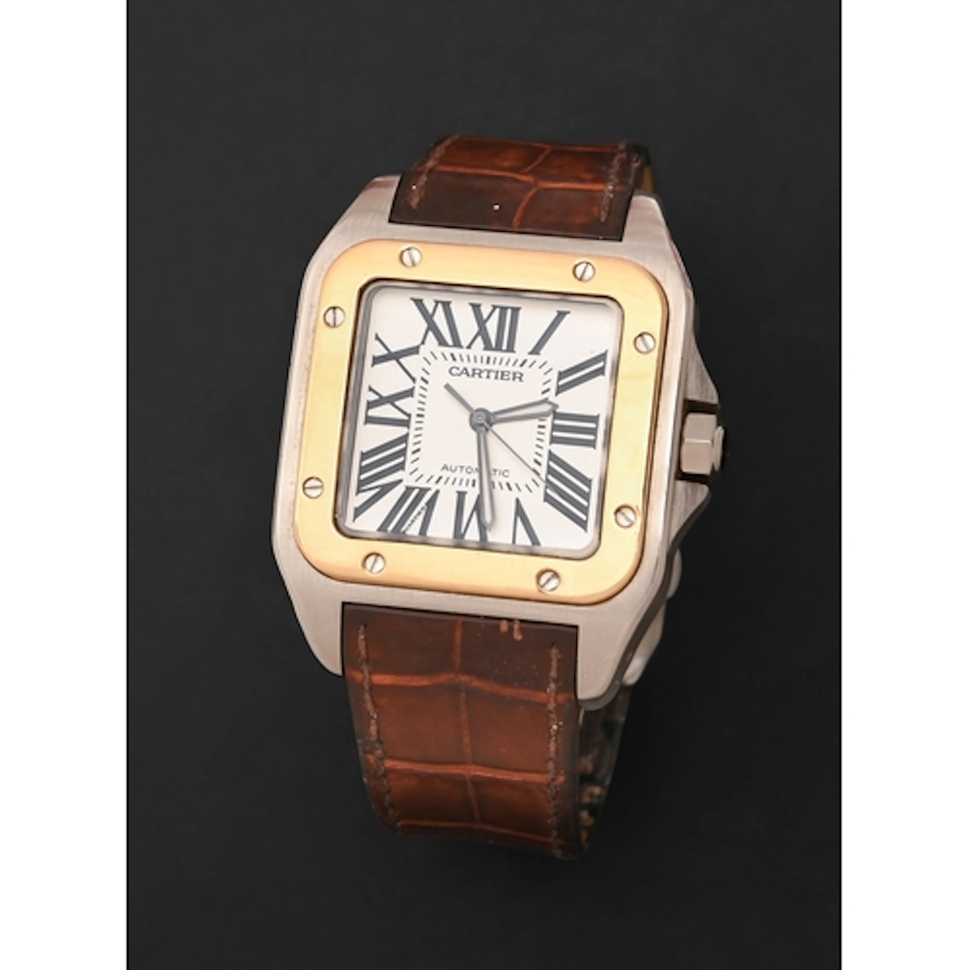 Cartier. An 18ct gold and stainless steel self-winding gentl...