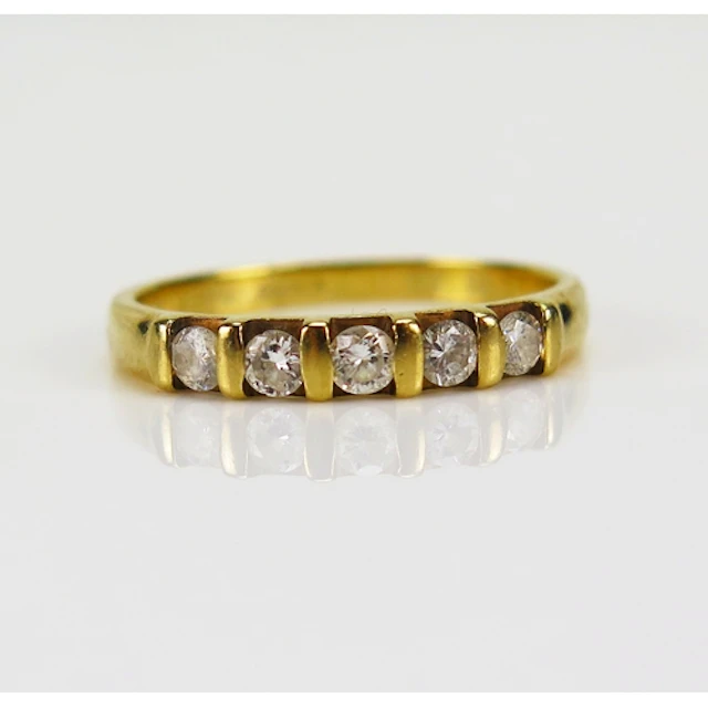 A diamond five stone half hoop ring, size S.5, hallmarked an...