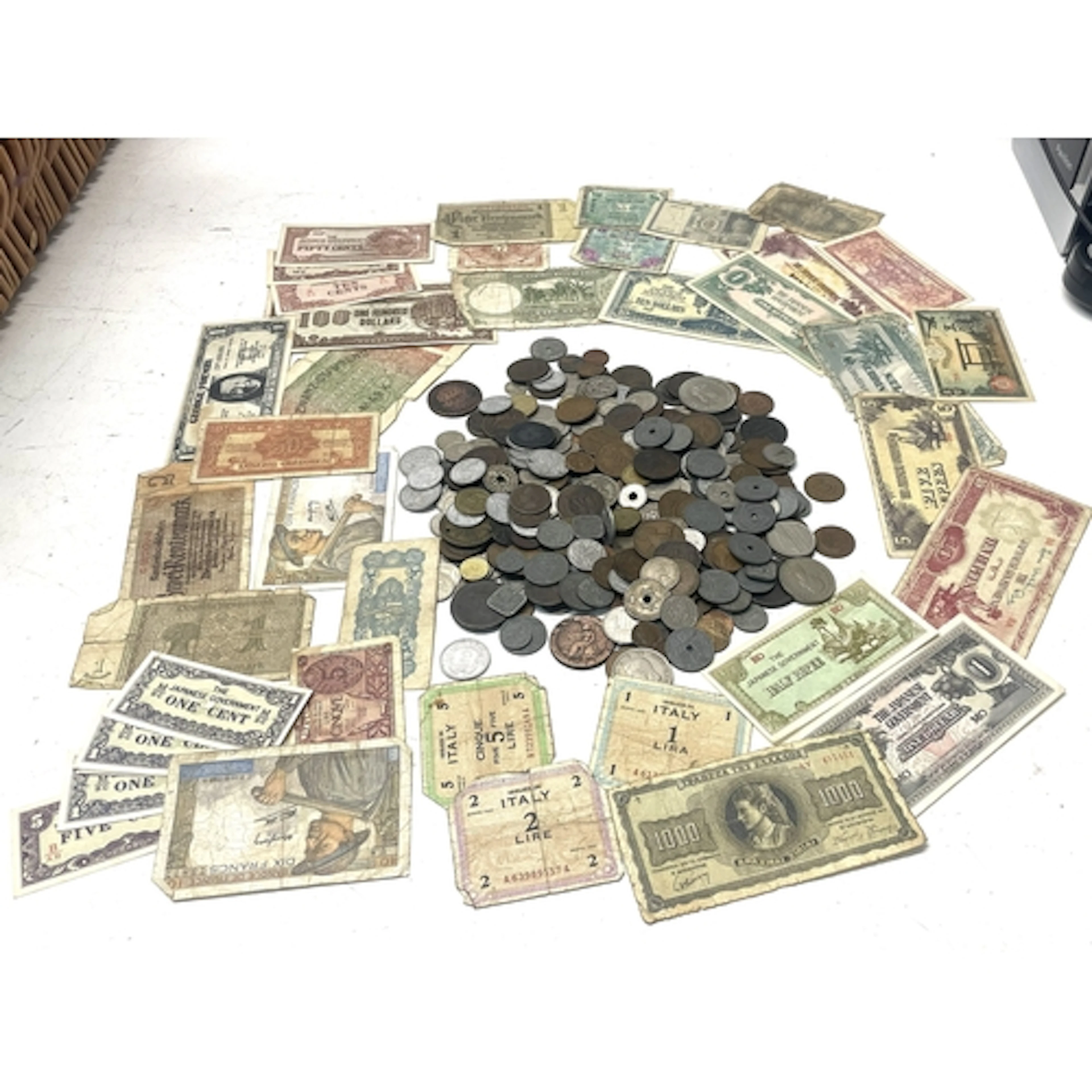 A collection of world coins and banknotes, to include exampl...