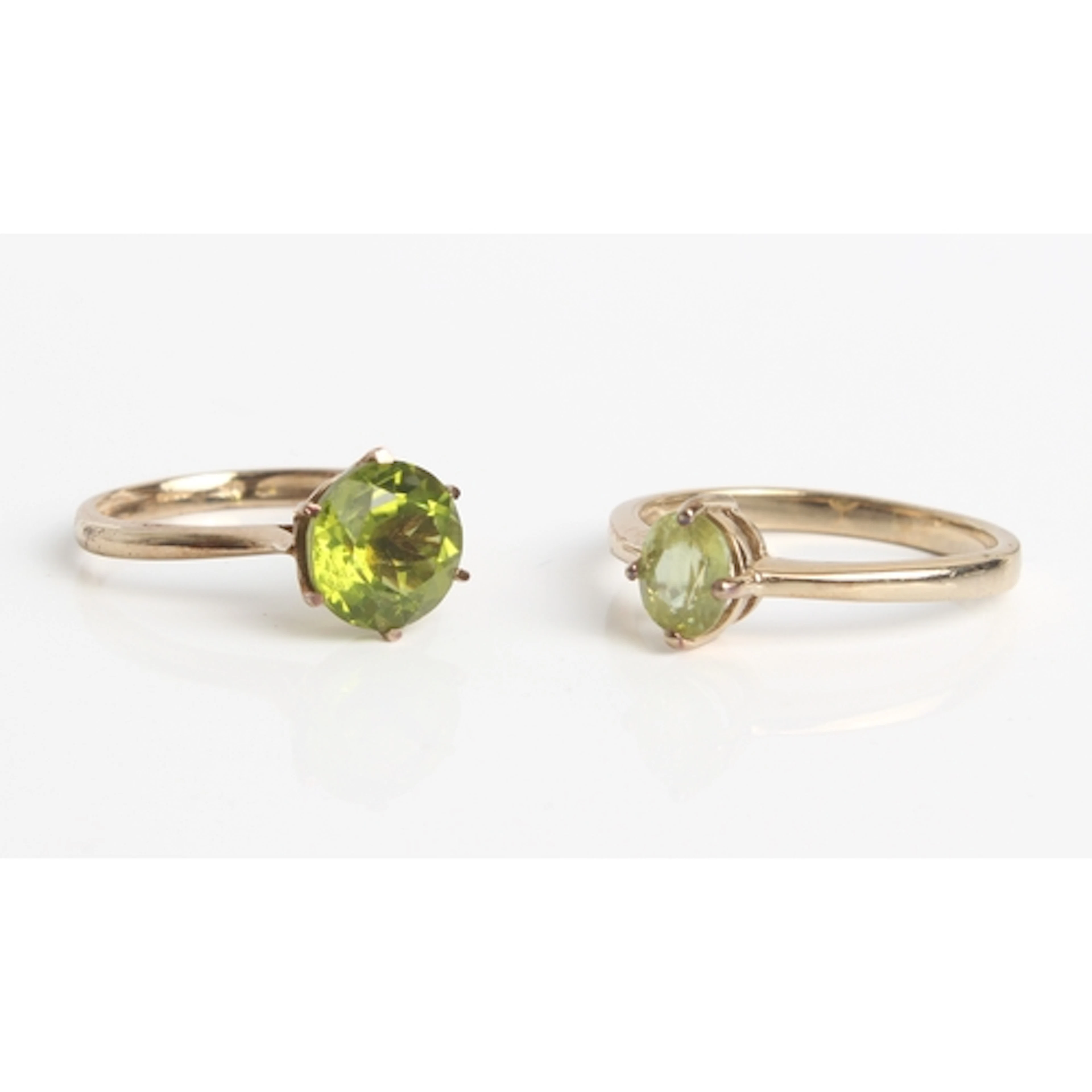 Two 9ct yellow gold and green gemstone rings - both Birmingh...