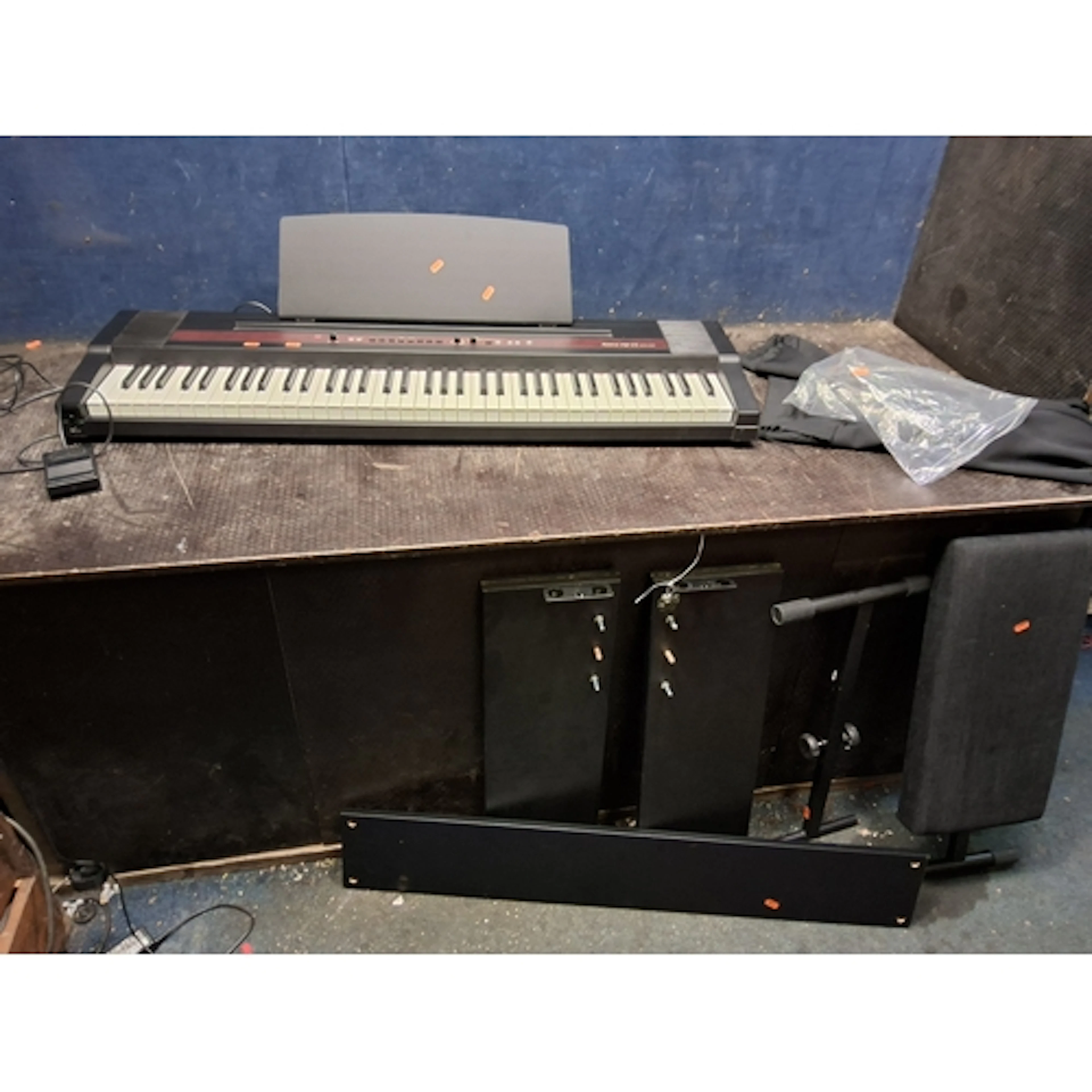 A ROLAND EP77 DIGITAL PIANO with power supply, footswitch, s...