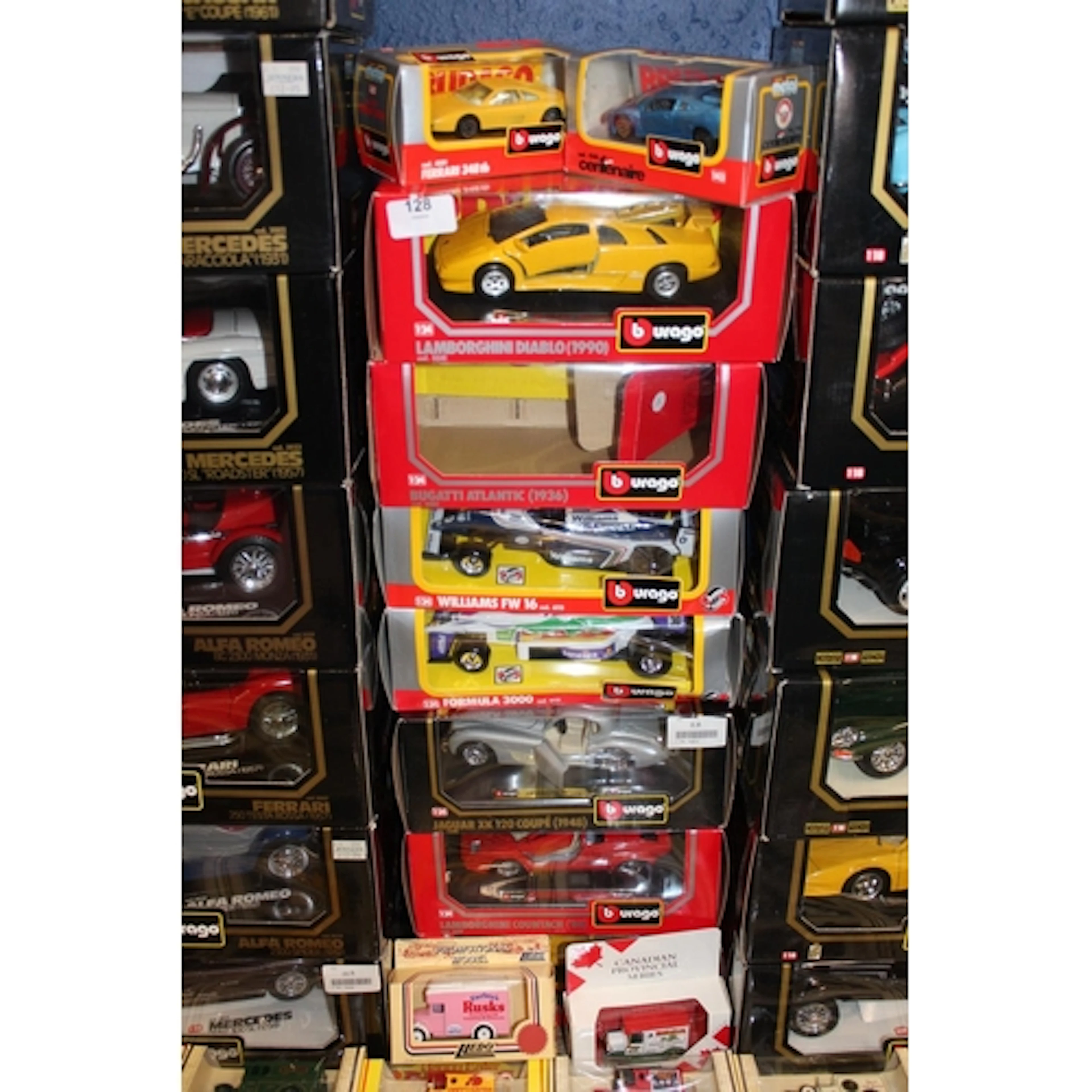 Six Burago 1:24 scale diecast model vehicles to include 0541...